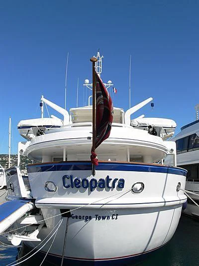 a white boat with blue lettering aboard CLEOPATRA Yacht for Sale