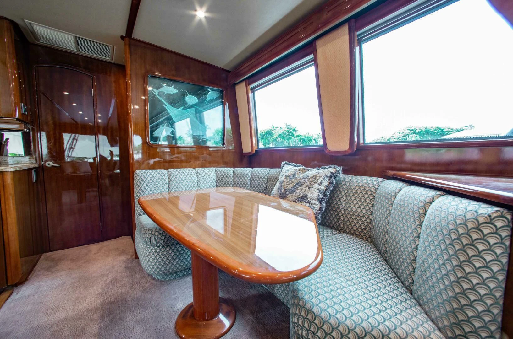 a table and a couch in a room aboard CURIOUS GEORGE Yacht for Sale