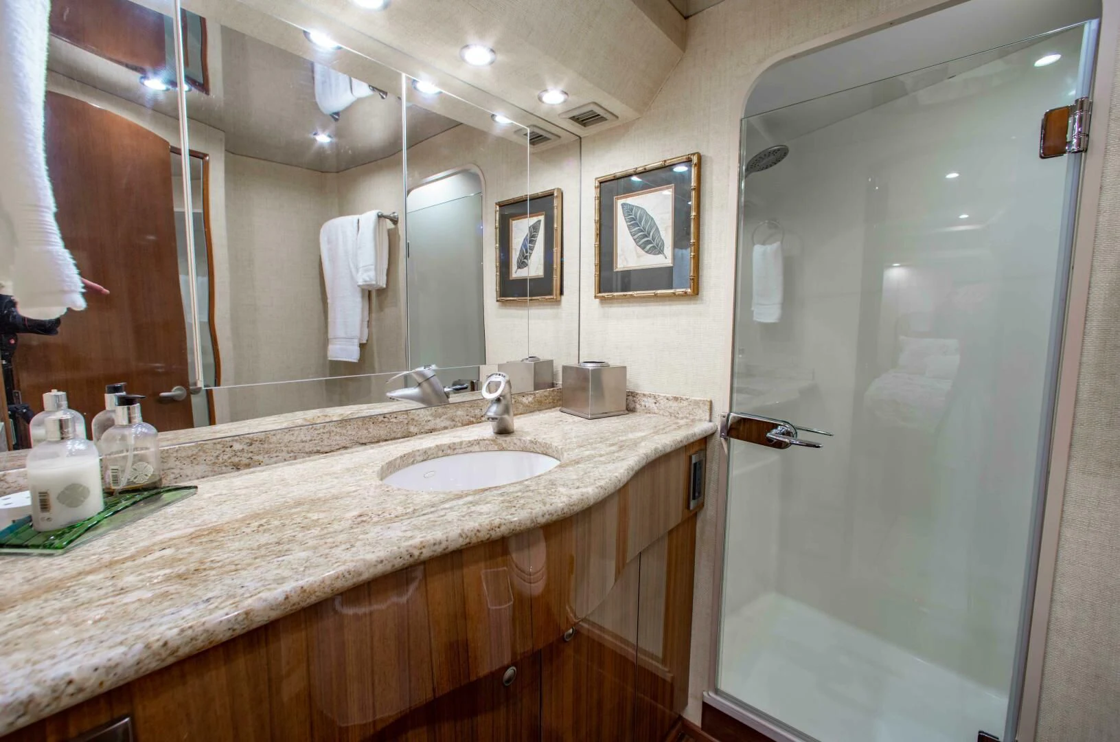 a bathroom with a large mirror aboard CURIOUS GEORGE Yacht for Sale
