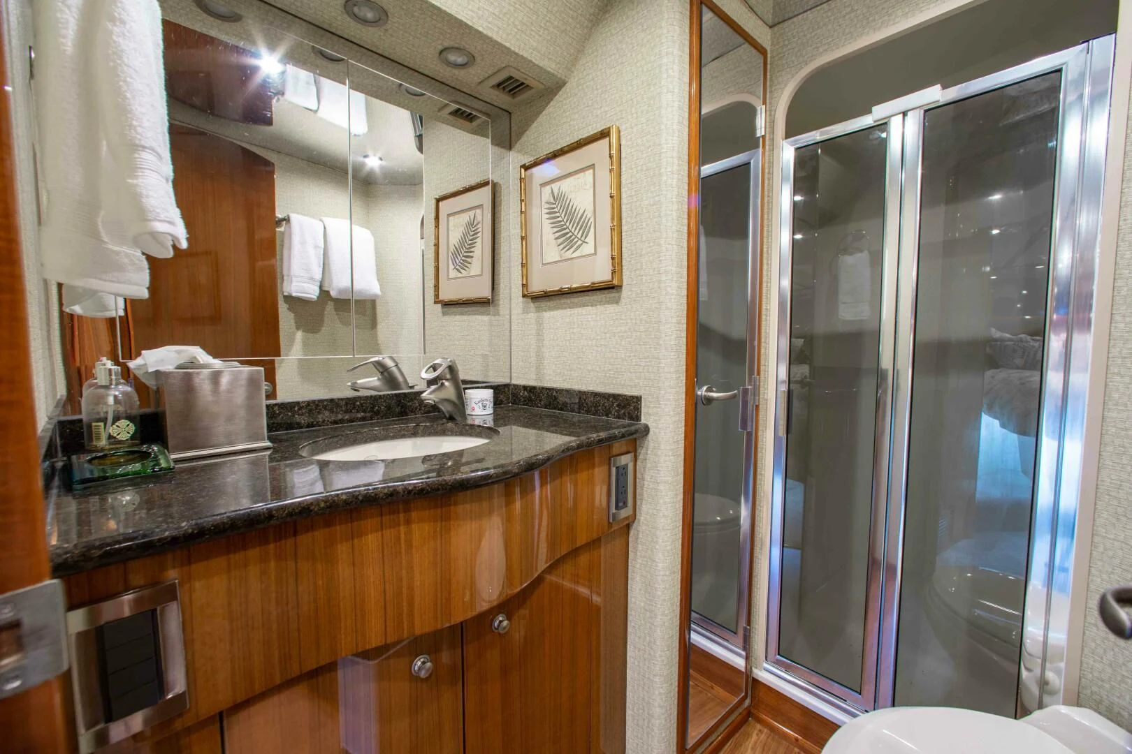 a bathroom with a glass shower aboard CURIOUS GEORGE Yacht for Sale