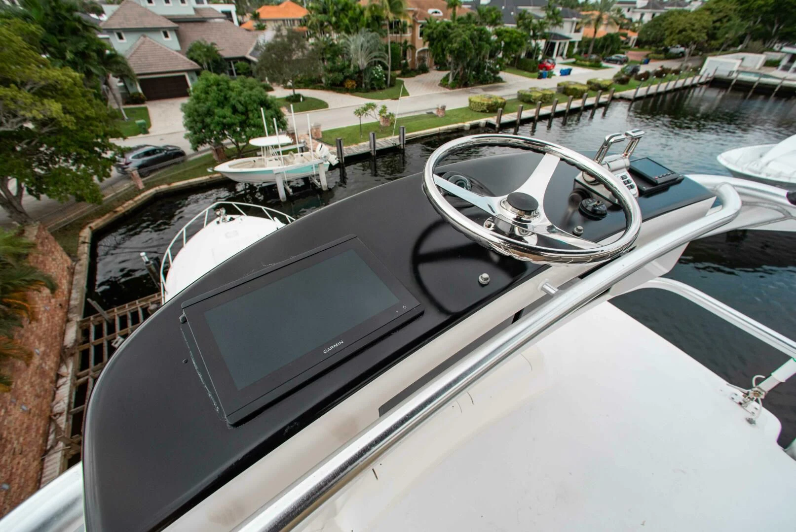 a cell phone on a car hood aboard CURIOUS GEORGE Yacht for Sale