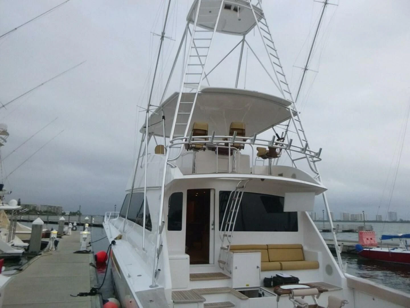 a white boat docked aboard CURIOUS GEORGE Yacht for Sale
