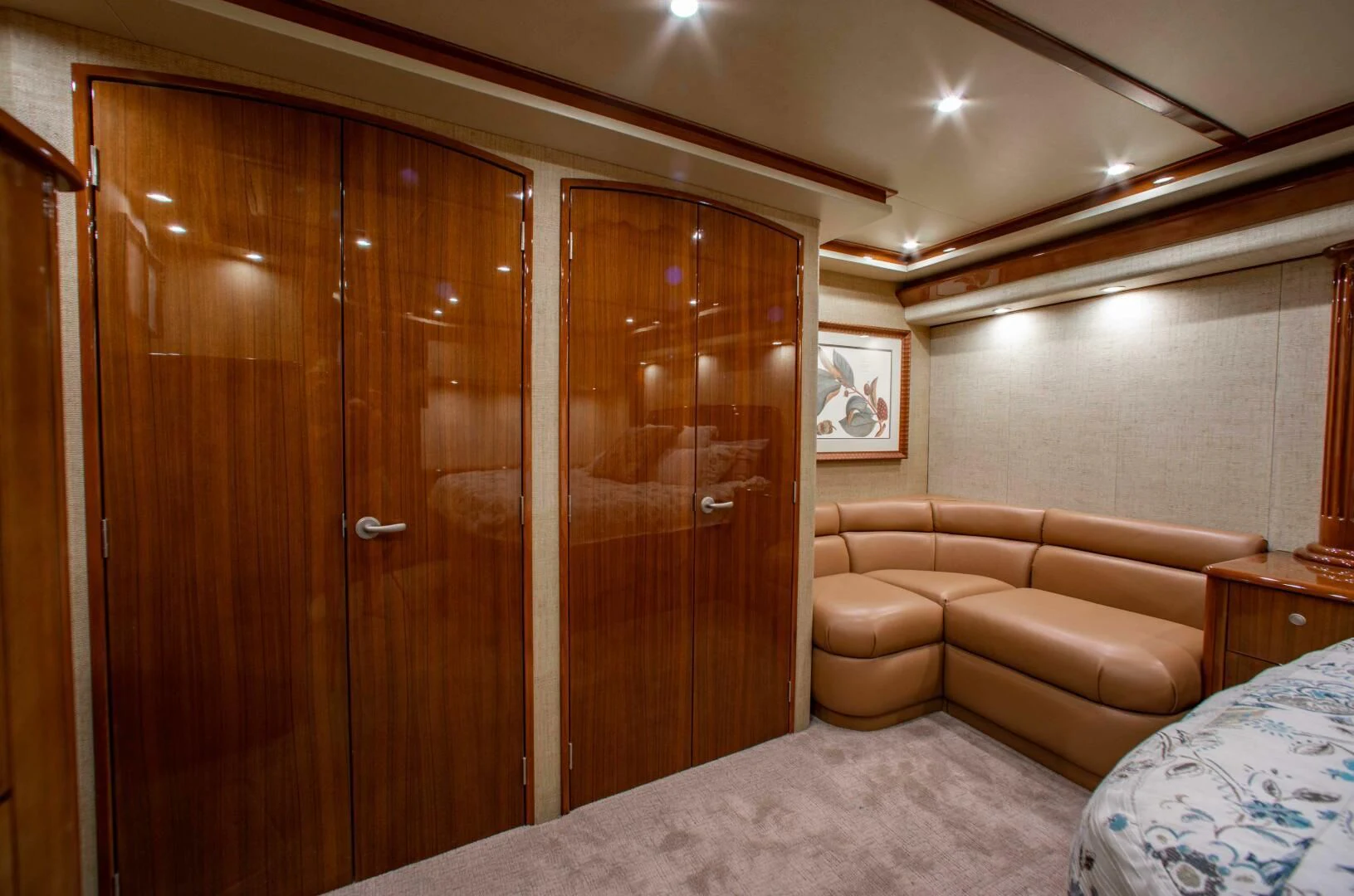 a room with a bed and a couch aboard CURIOUS GEORGE Yacht for Sale