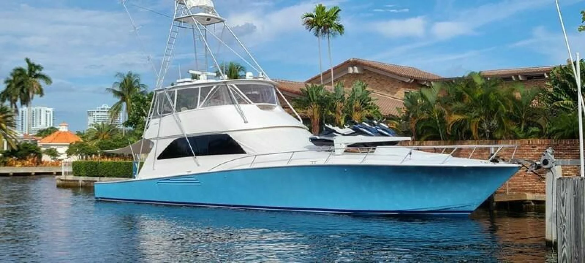 a white boat in a body of water aboard CURIOUS GEORGE Yacht for Sale