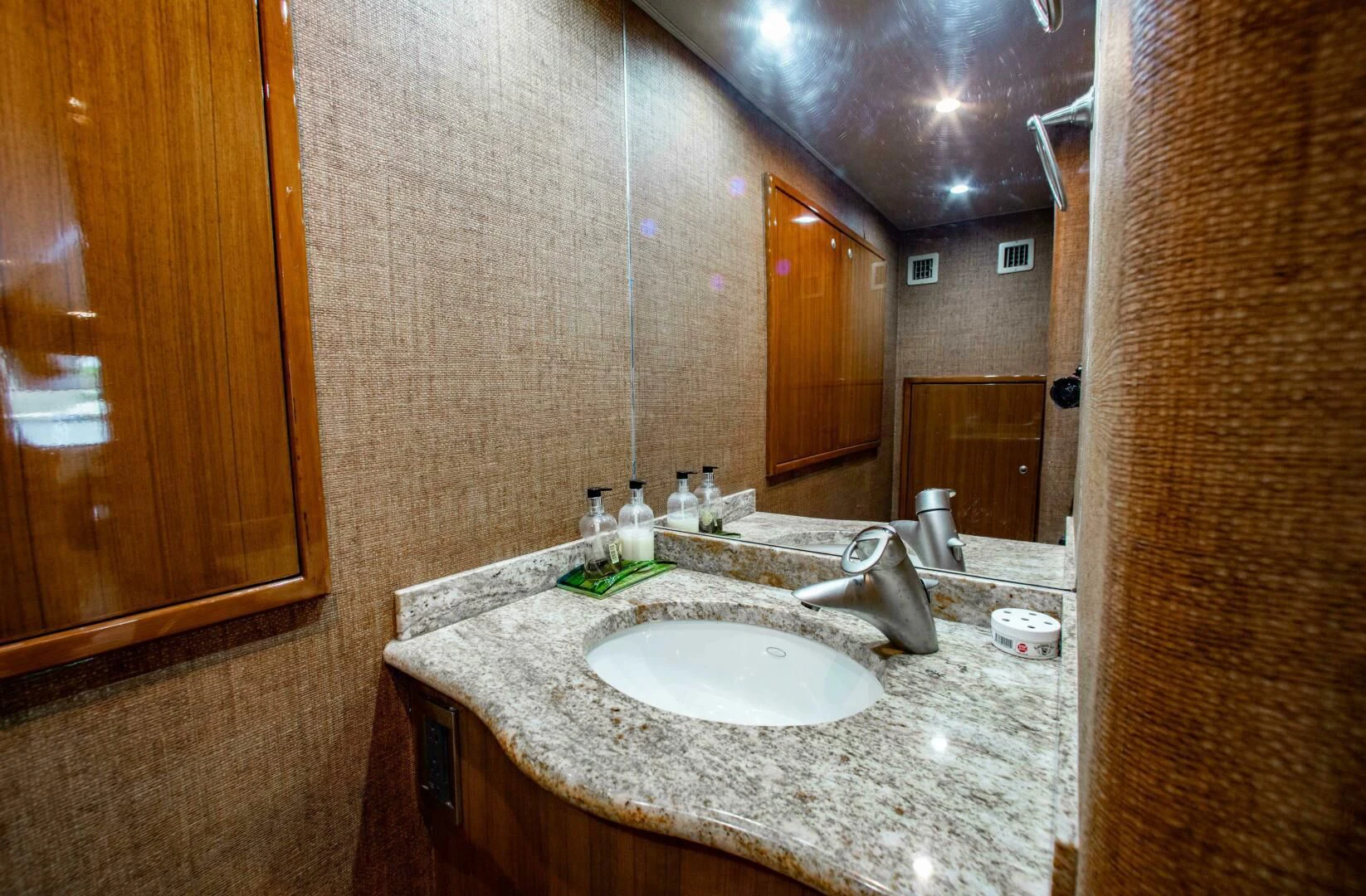 a bathroom with a large mirror aboard CURIOUS GEORGE Yacht for Sale
