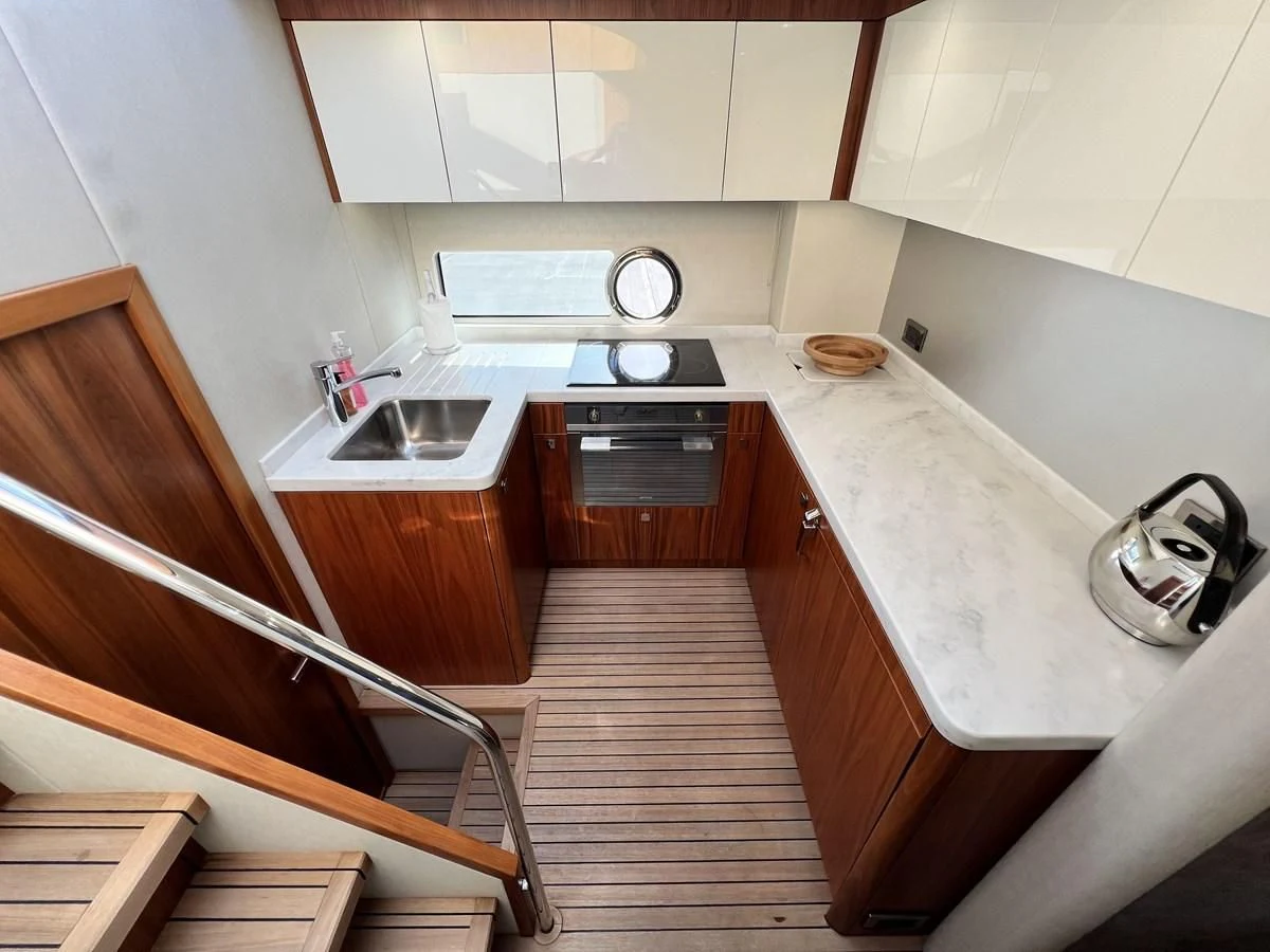 a kitchen with a sink and a stove aboard SUNSEEKER PREDATOR 68 Yacht for Sale