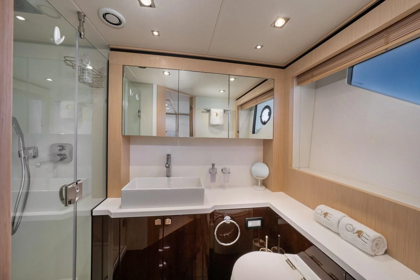 a bathroom with a large mirror aboard SUNSEEKER PREDATOR 68 Yacht for Sale