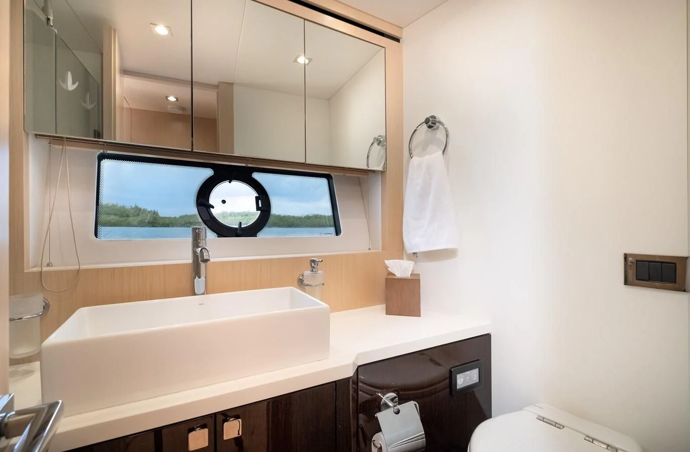 a bathroom with a large mirror aboard SUNSEEKER PREDATOR 68 Yacht for Sale