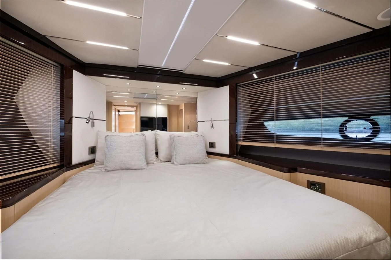 a large bed with a large white bed spread aboard SUNSEEKER PREDATOR 68 Yacht for Sale