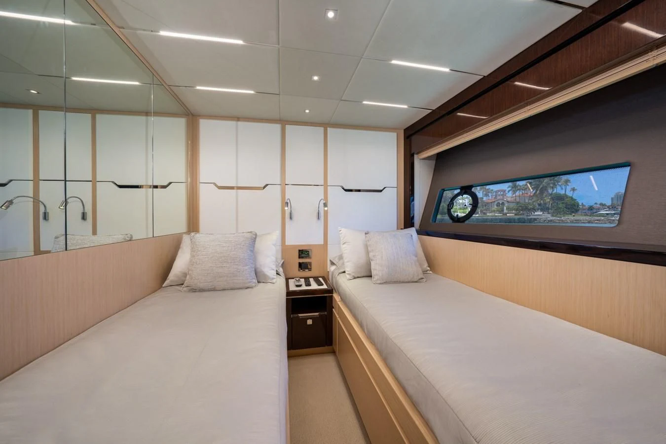 a room with a bed and a tv on the wall aboard SUNSEEKER PREDATOR 68 Yacht for Sale