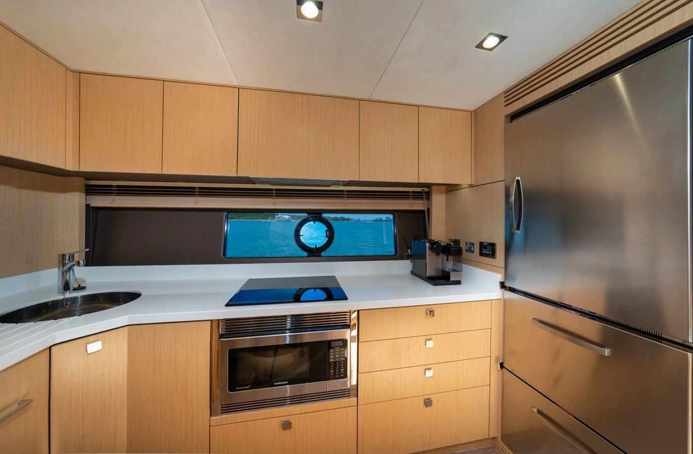 a kitchen with a stove and oven aboard SUNSEEKER PREDATOR 68 Yacht for Sale