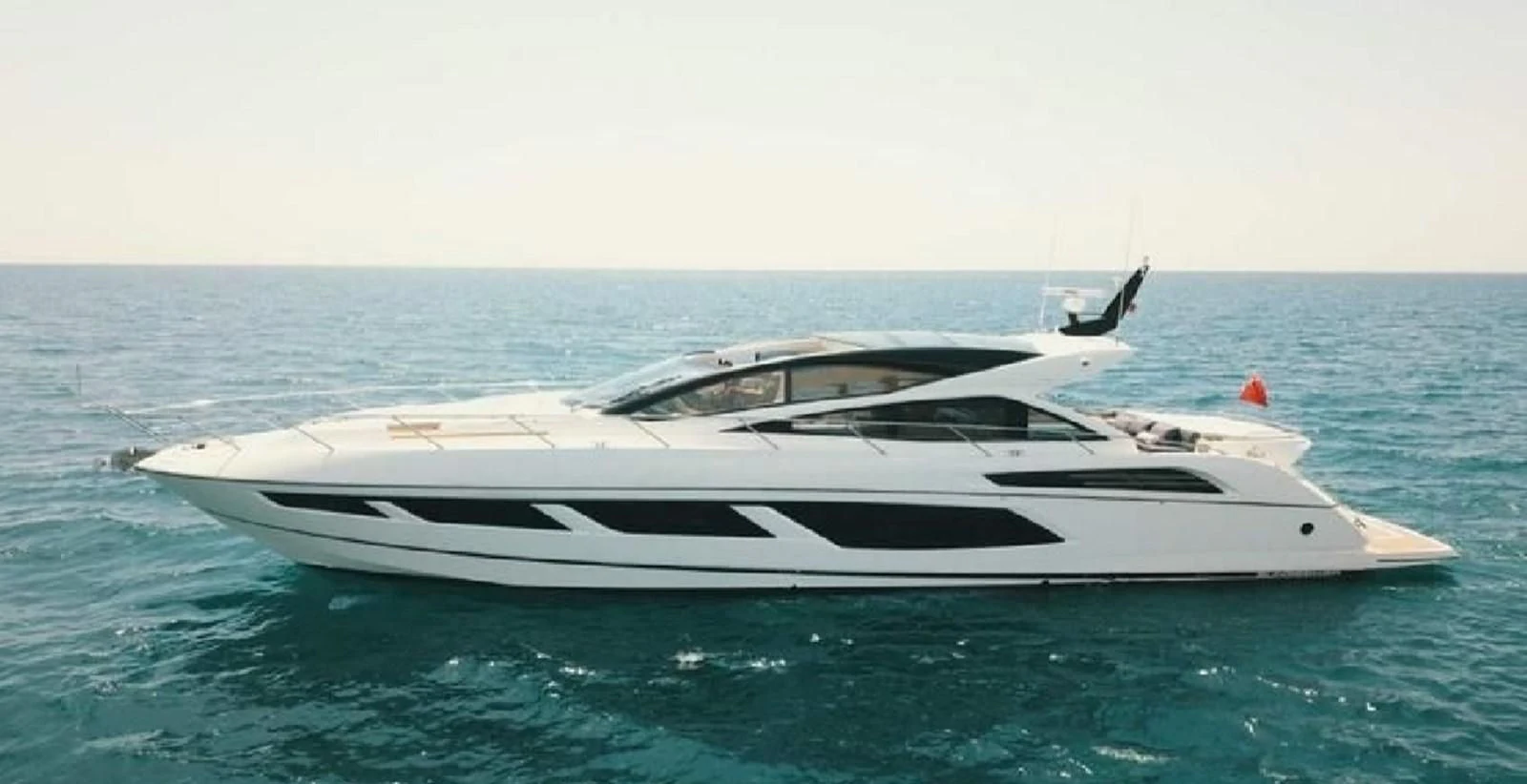 a white yacht in the ocean aboard SUNSEEKER PREDATOR 68 Yacht for Sale