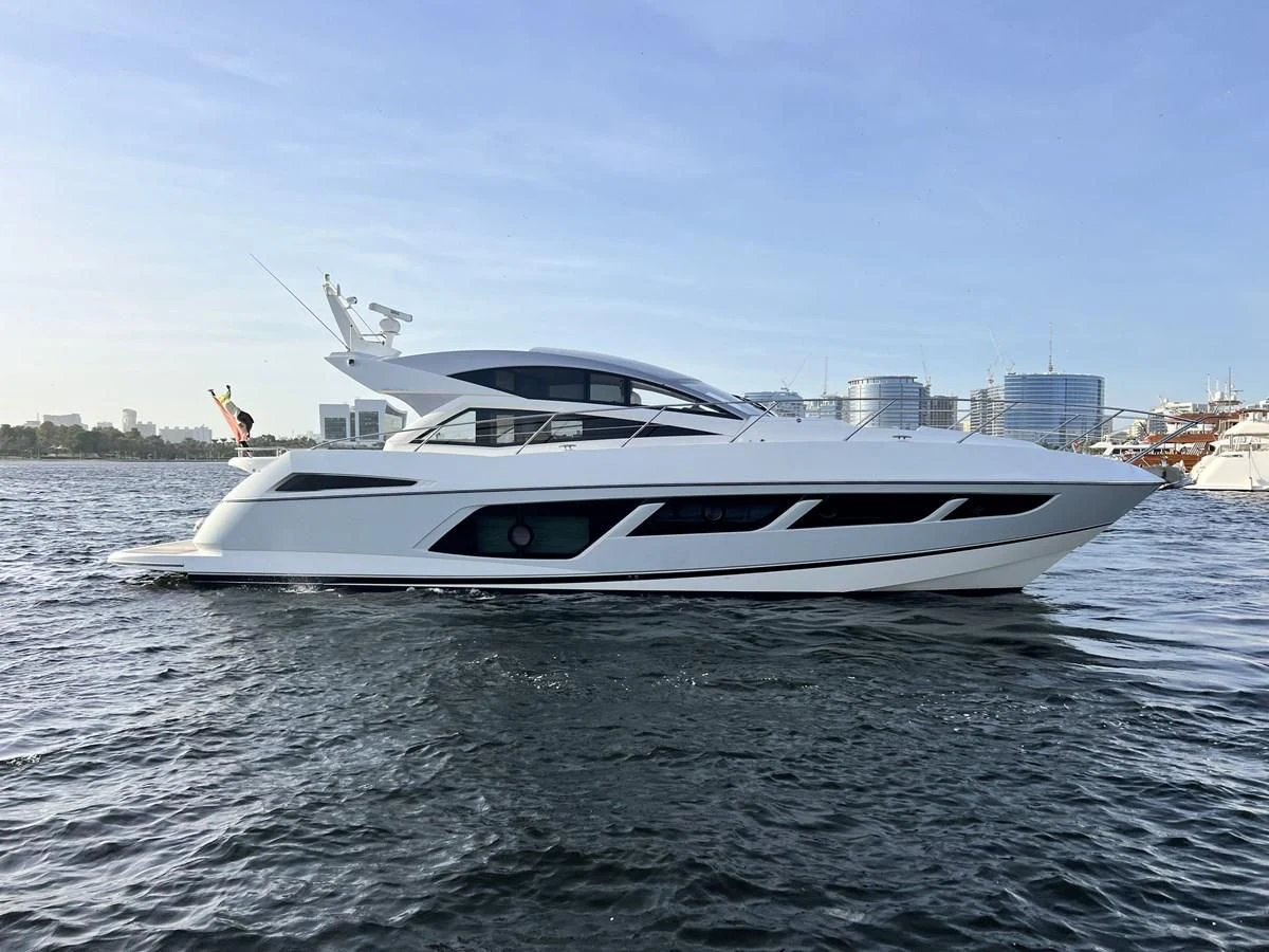 a white yacht on the water aboard SUNSEEKER PREDATOR 68 Yacht for Sale