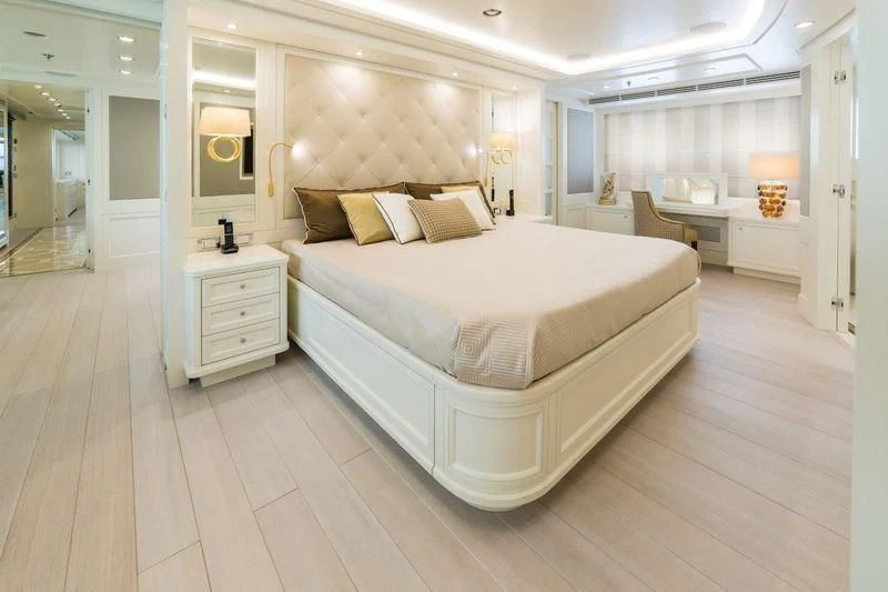 a large white bed in a room aboard DRAGOLUNA Yacht for Sale
