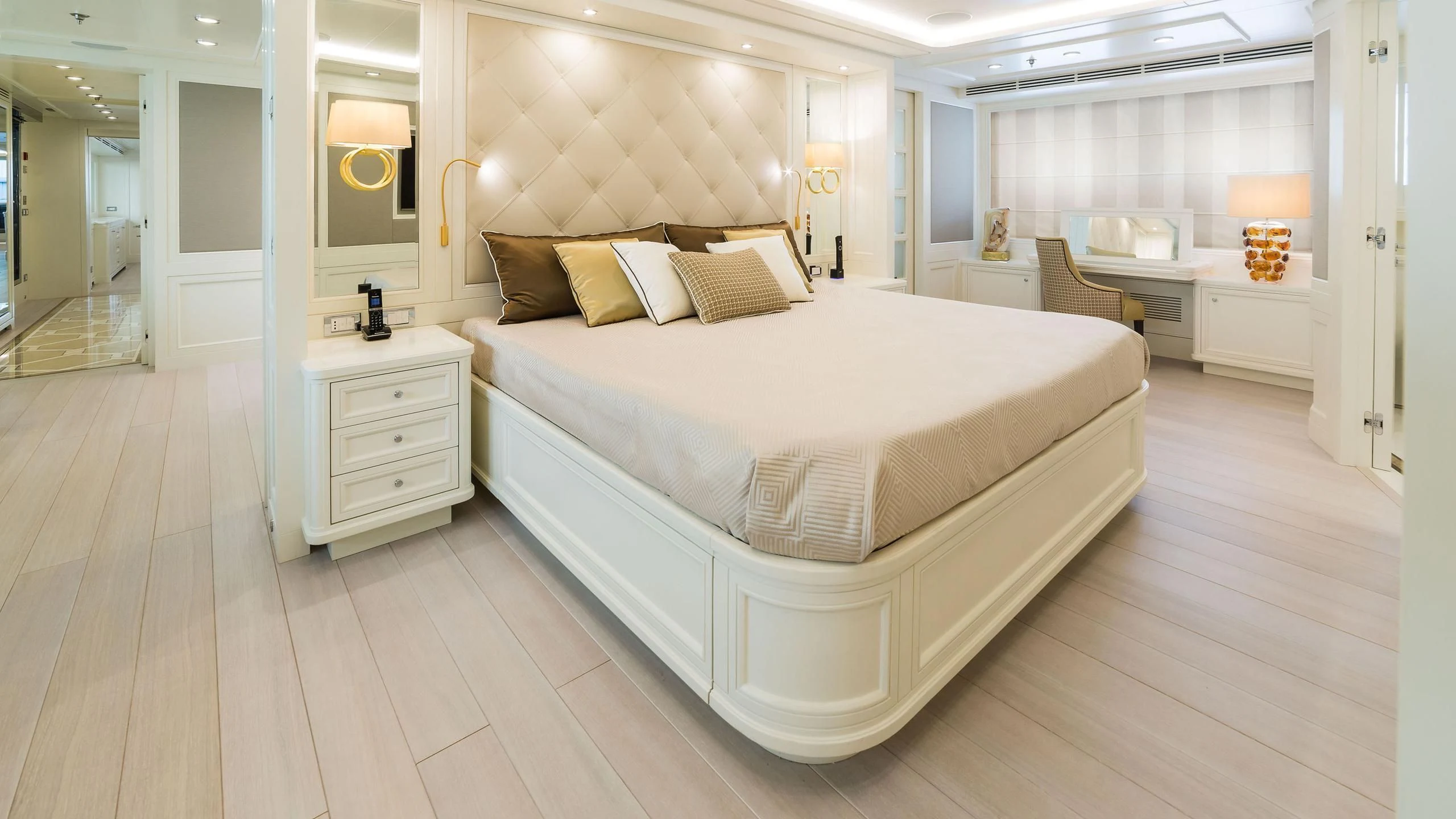 a large white bed in a room aboard DRAGOLUNA Yacht for Sale