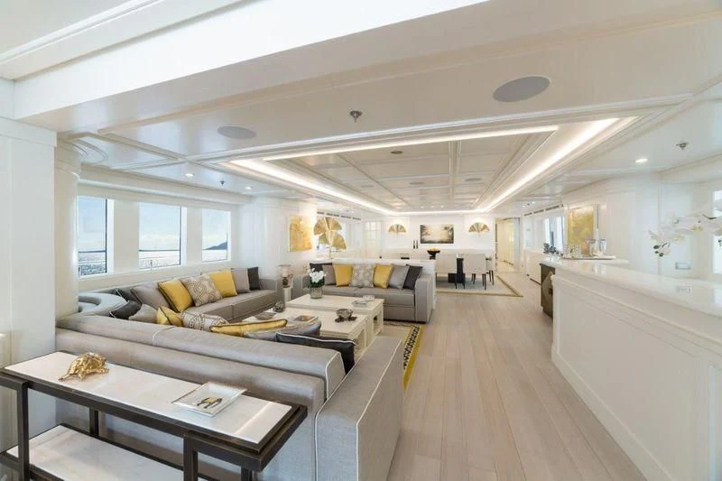 a living room with a couch and a table aboard DRAGOLUNA Yacht for Sale
