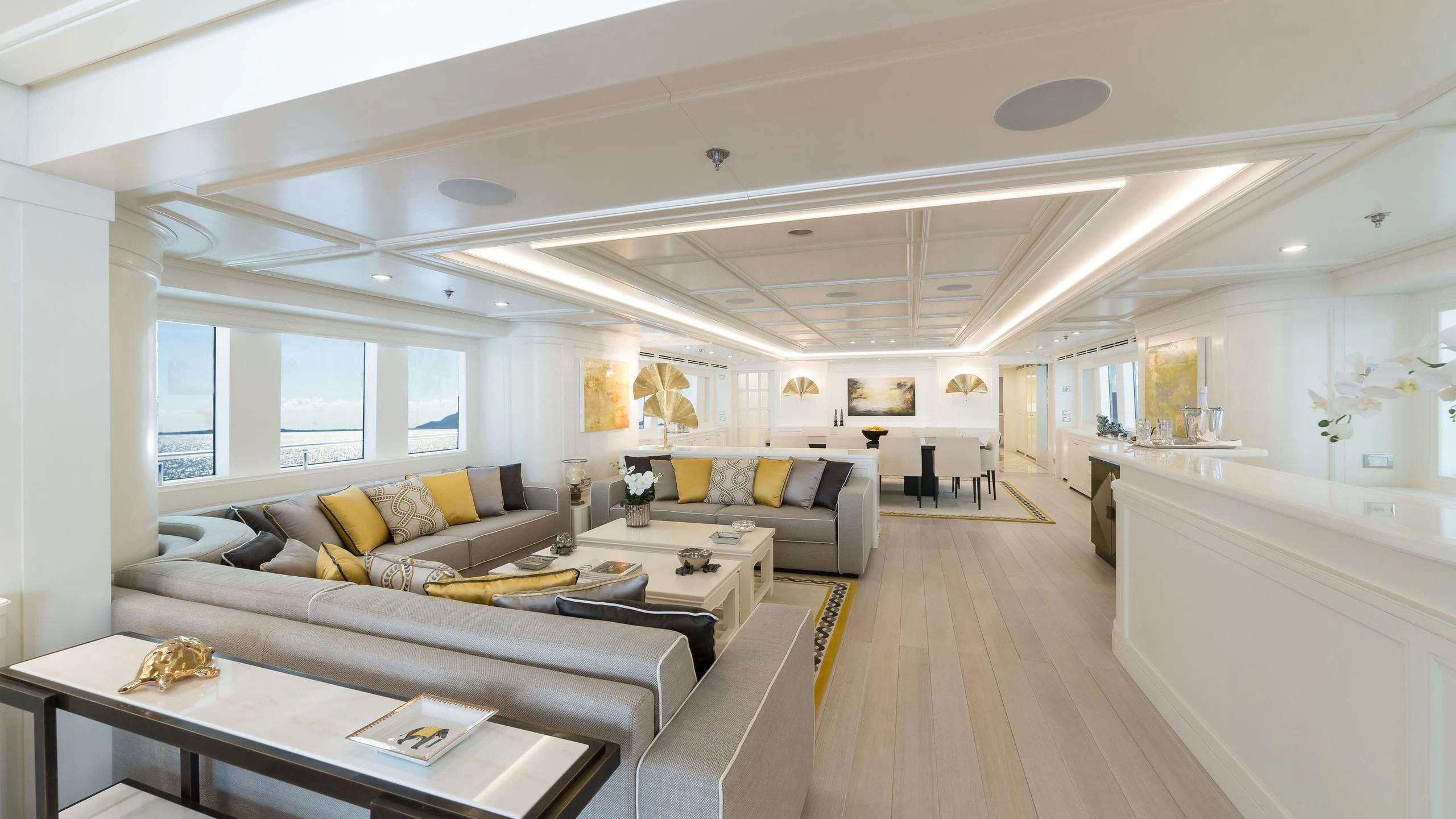 a living room with a couch and a table aboard DRAGOLUNA Yacht for Sale
