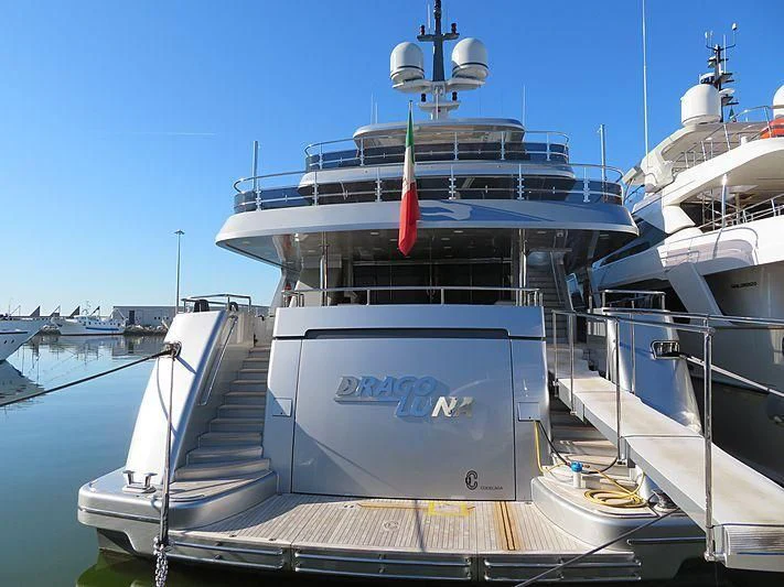 a large boat docked at a pier aboard DRAGOLUNA Yacht for Sale