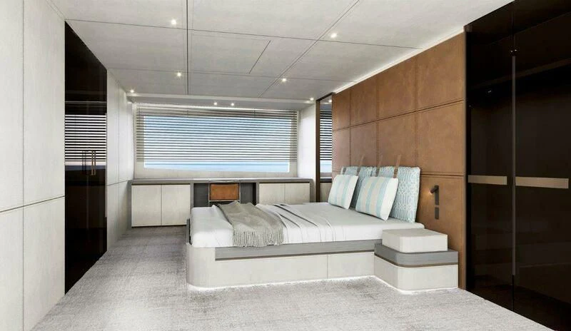 a room with a bed and a large mirror aboard NADA Yacht for Sale
