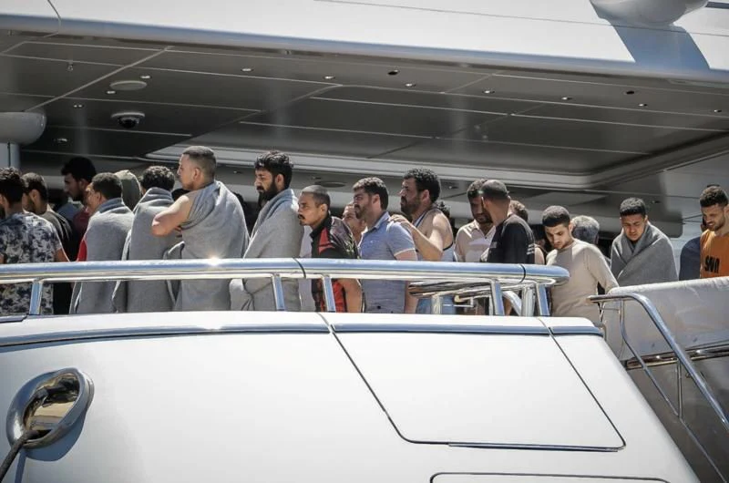 a group of people in a building aboard MAYAN QUEEN IV Yacht for Sale
