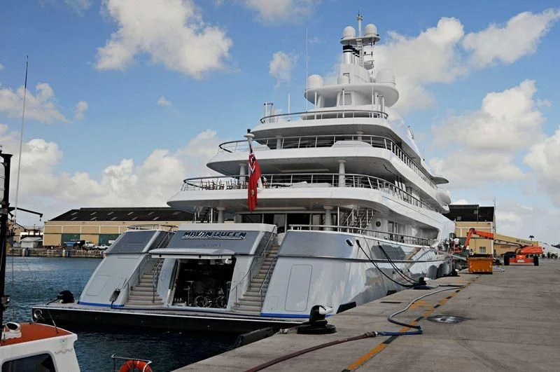 a large white ship docked aboard MAYAN QUEEN IV Yacht for Sale