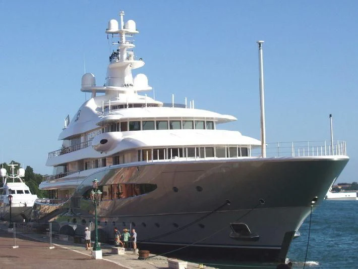 a large cruise ship docked aboard MAYAN QUEEN IV Yacht for Sale