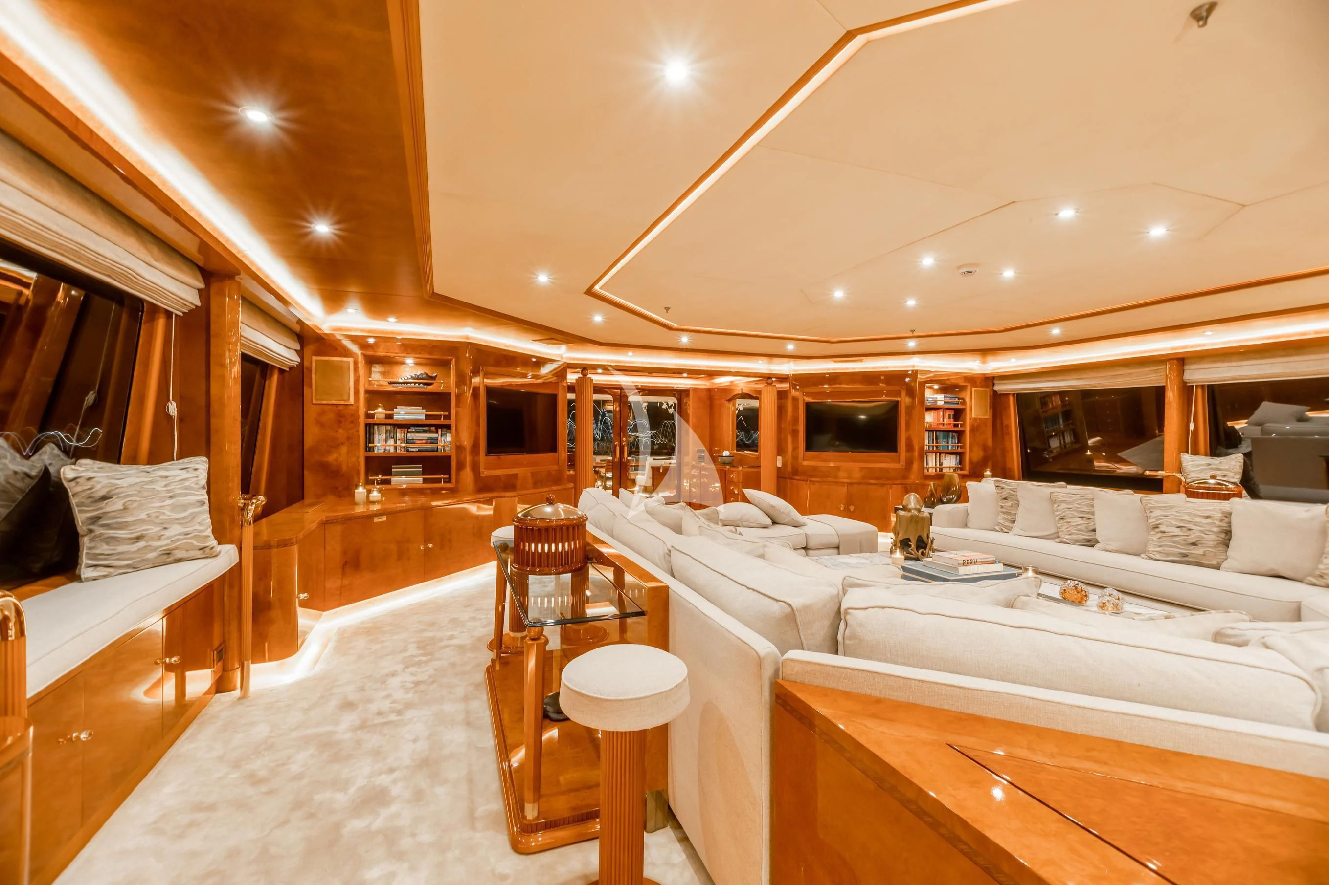 a room with a bed and a table aboard AQUA MARE Yacht for Sale