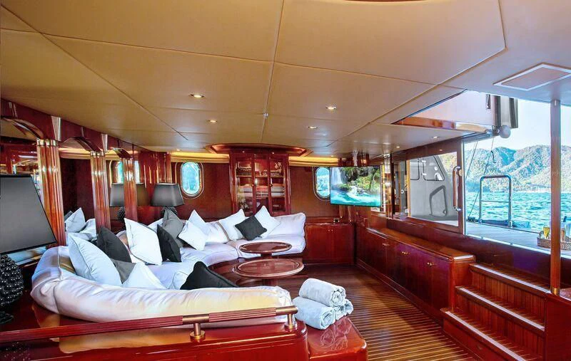 a room with a bed and a television aboard AQUA MARE Yacht for Sale