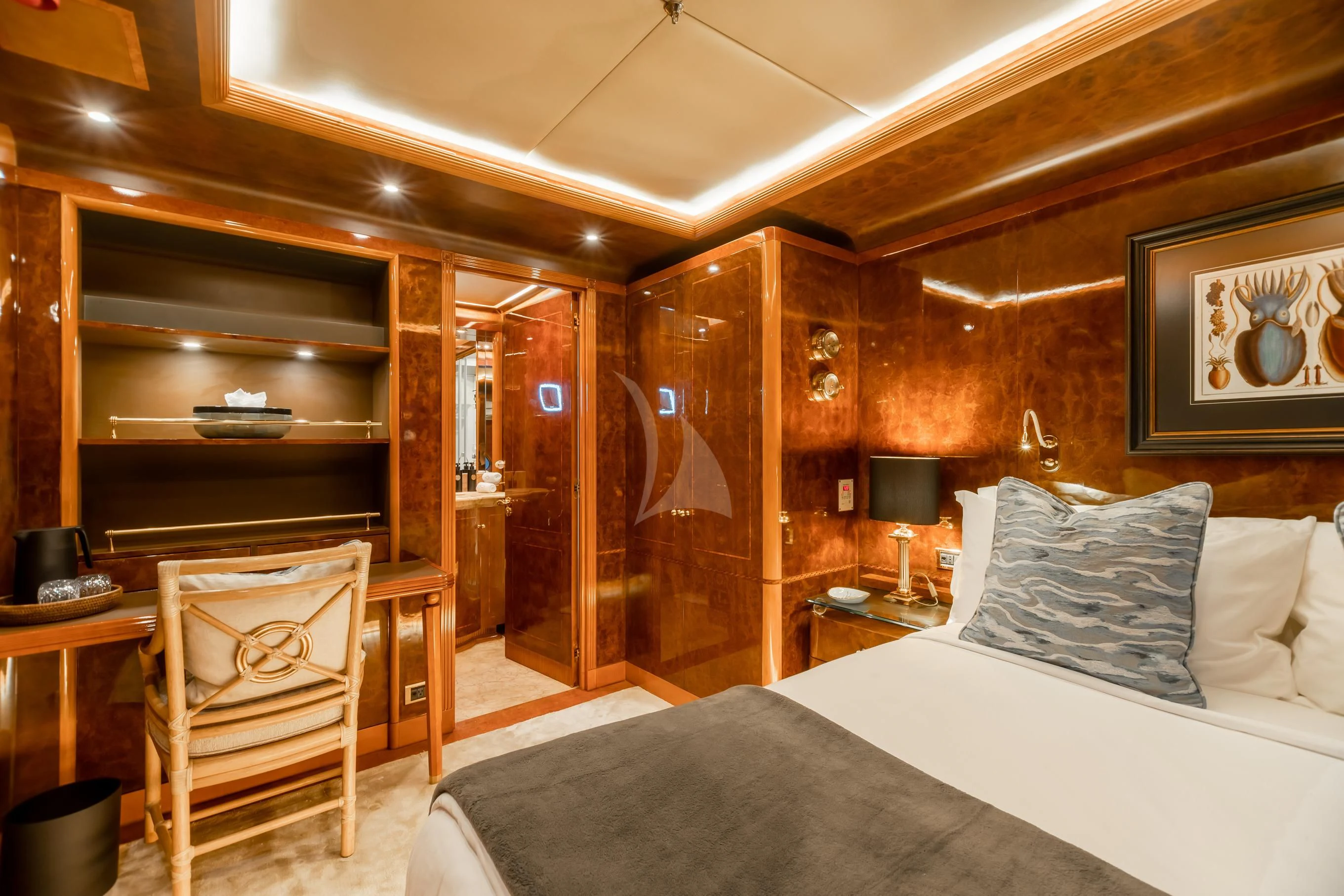 a room with a bed and a chair aboard AQUA MARE Yacht for Sale