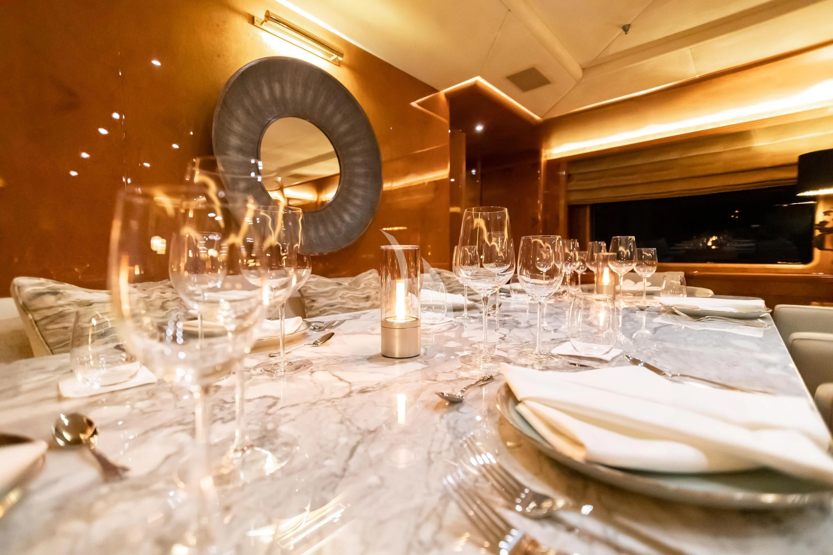 a table with empty glasses aboard AQUA MARE Yacht for Sale