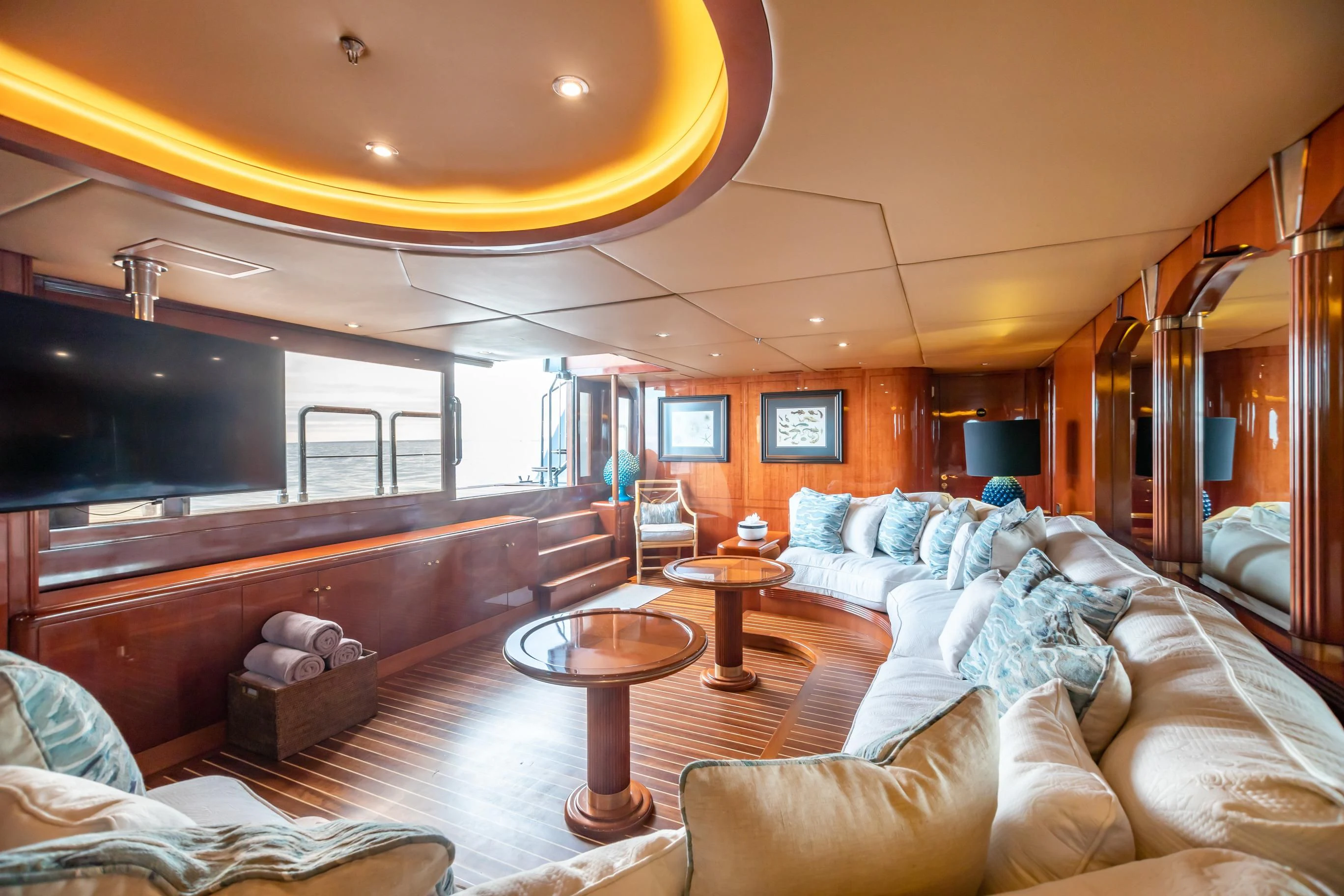a large living room with a large mirror aboard AQUA MARE Yacht for Sale