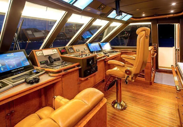 a room with a desk and chairs aboard AQUA MARE Yacht for Sale