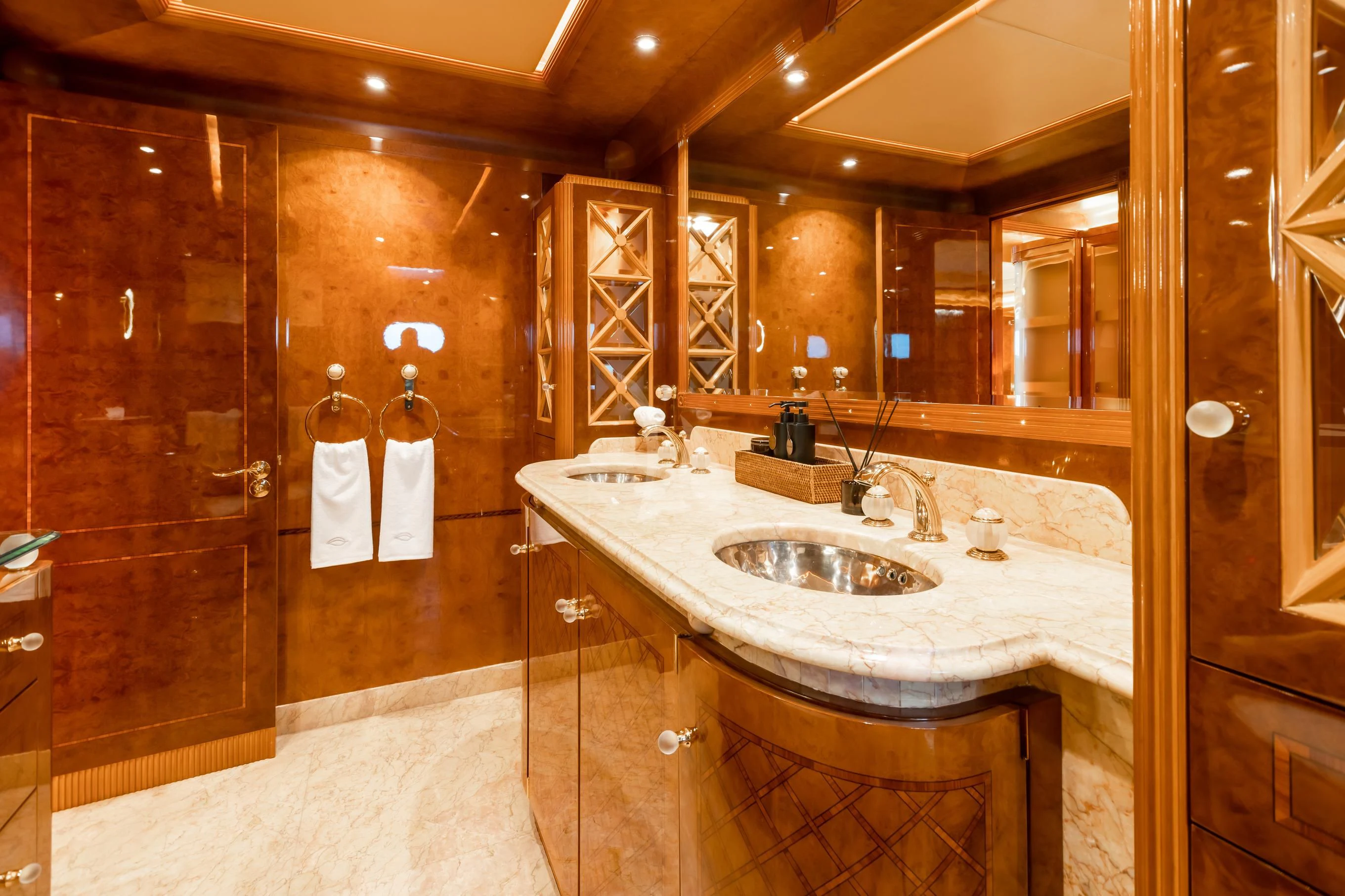 a bathroom with a sink and a mirror aboard AQUA MARE Yacht for Sale