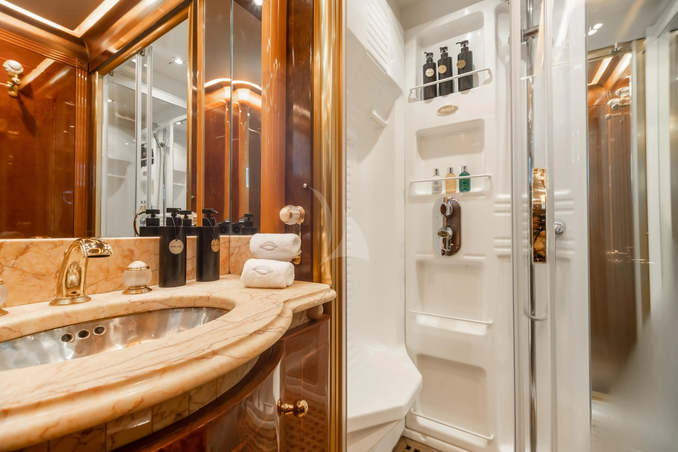 a bathroom with a sink and a mirror aboard AQUA MARE Yacht for Sale