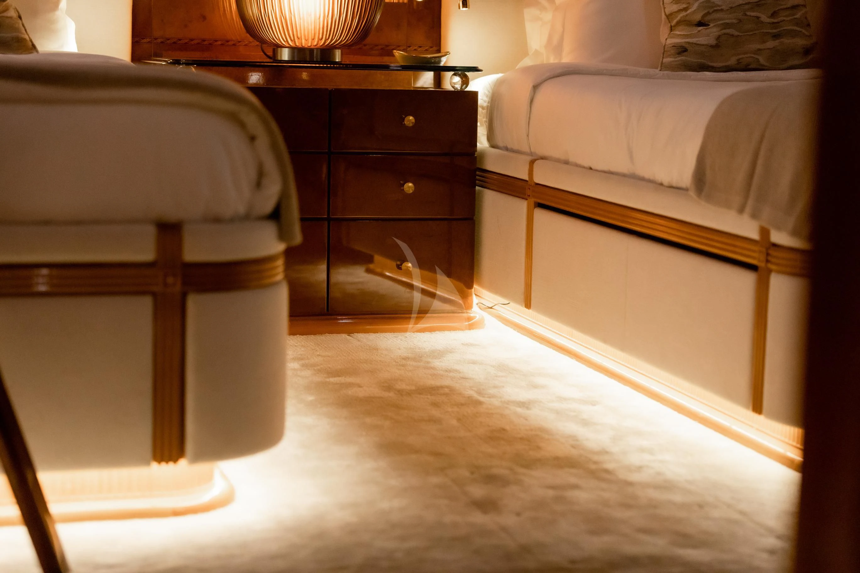 a bedroom with a bed and a chair aboard AQUA MARE Yacht for Sale