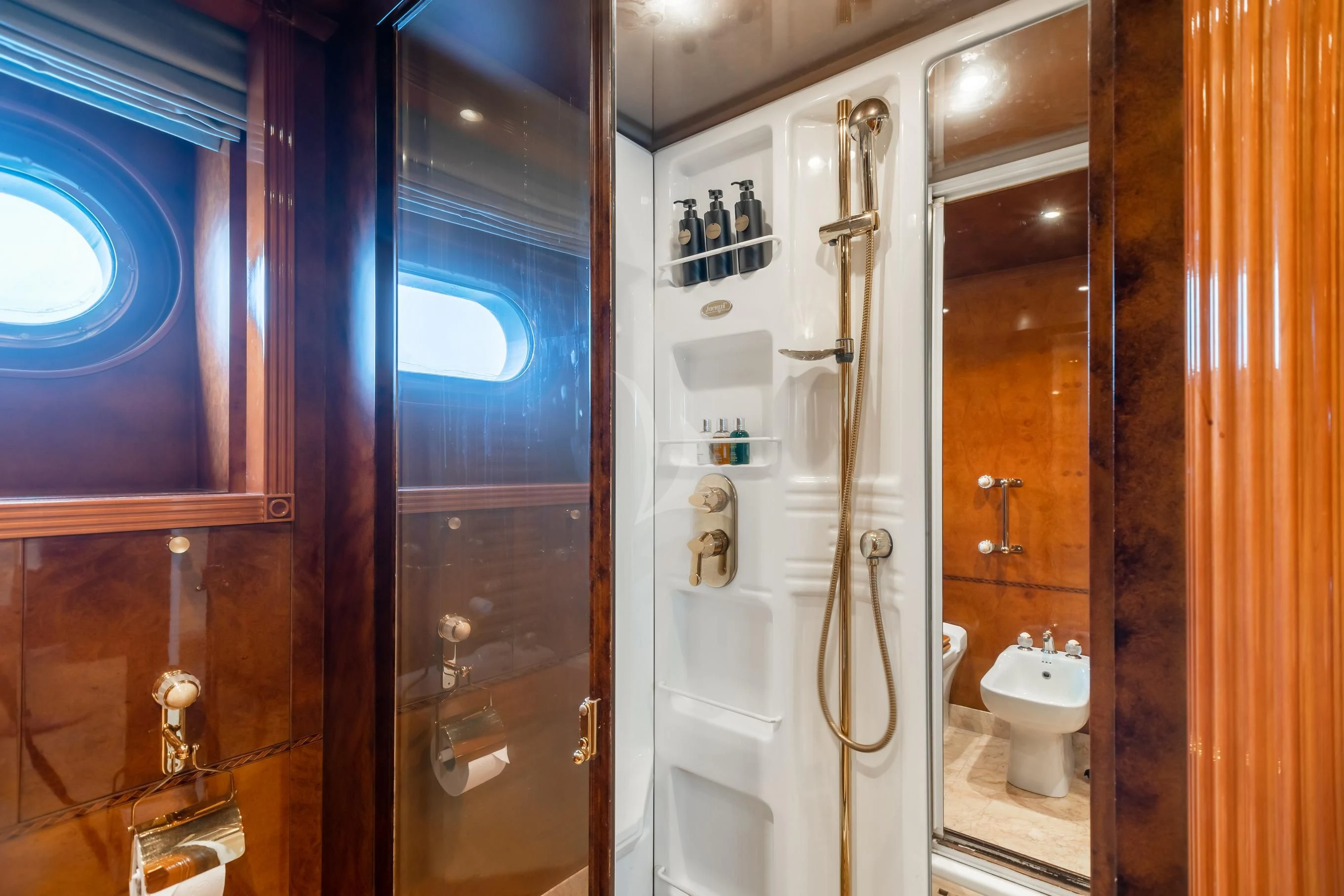 a bathroom with a glass shower aboard AQUA MARE Yacht for Sale