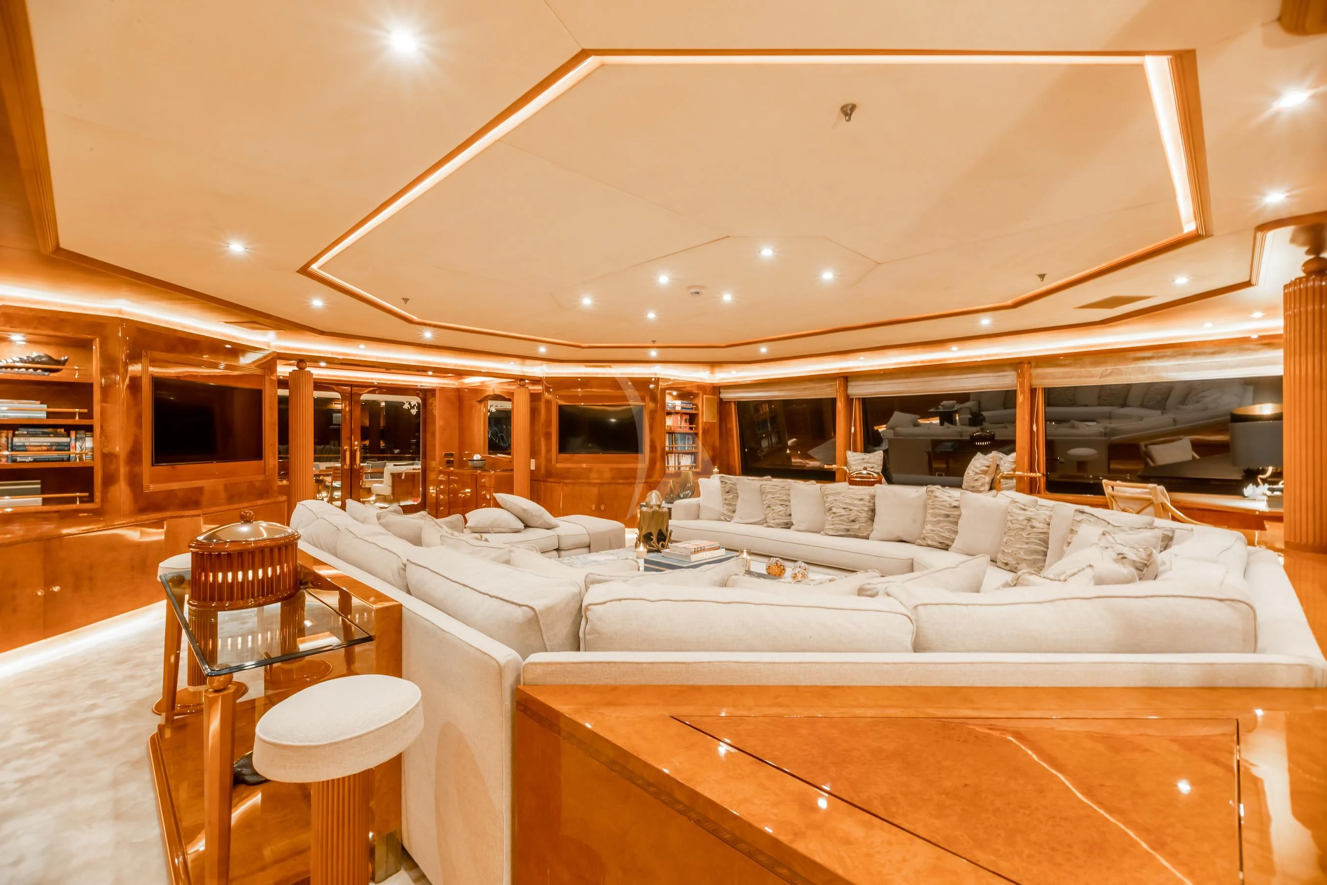 a large living room with a large bed and a large window aboard AQUA MARE Yacht for Sale