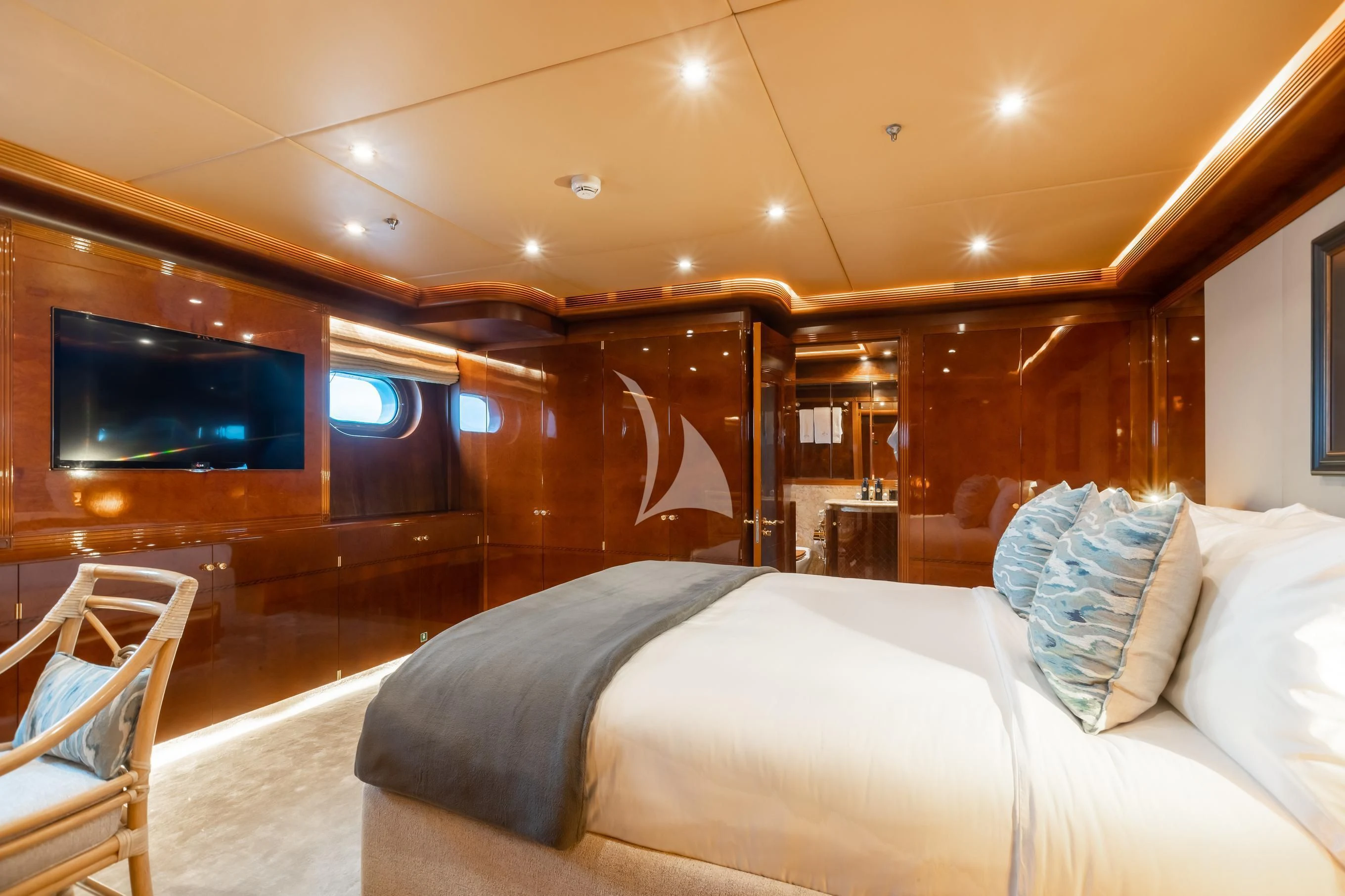 a room with a bed and a television aboard AQUA MARE Yacht for Sale