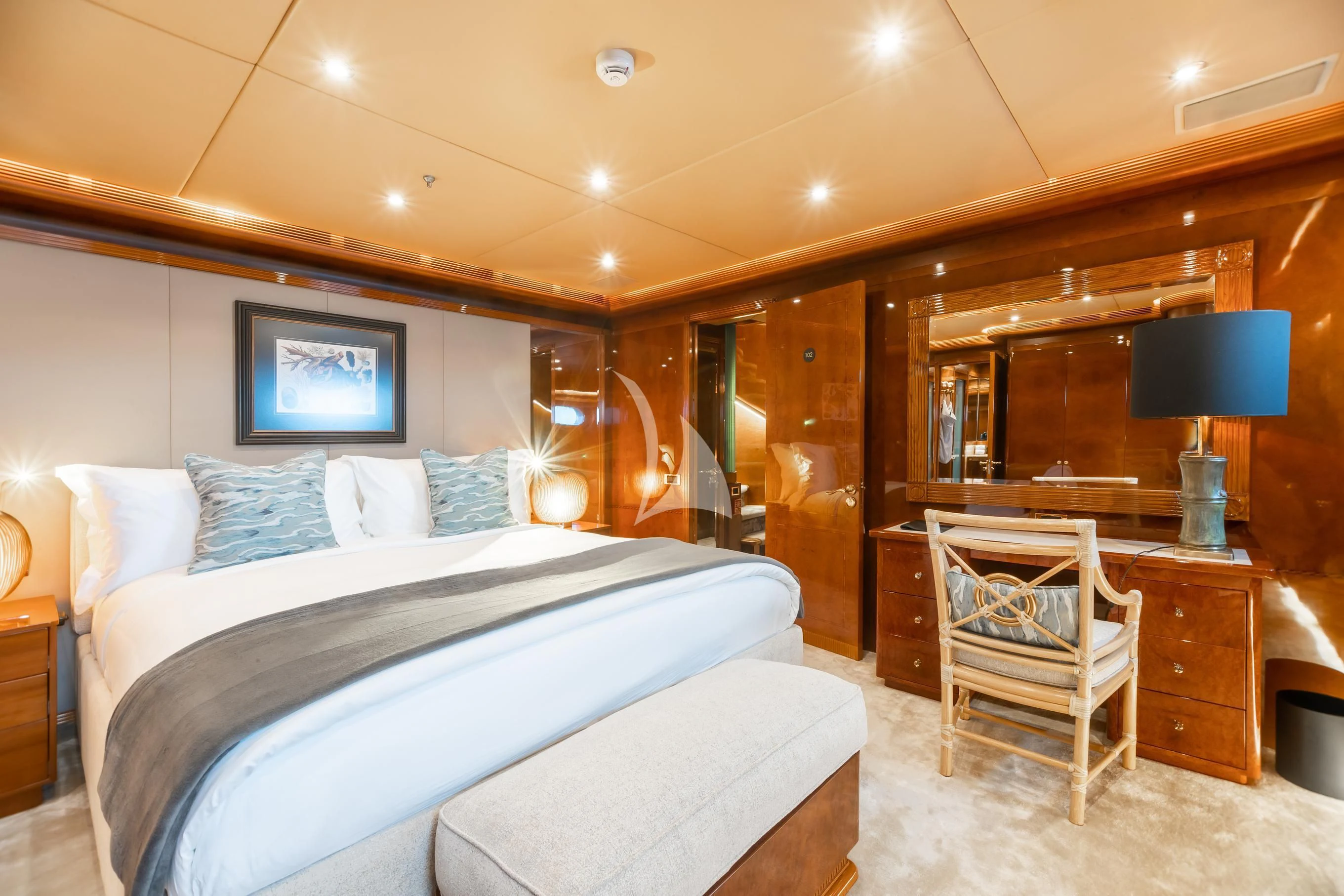 a bedroom with a bed and a desk aboard AQUA MARE Yacht for Sale