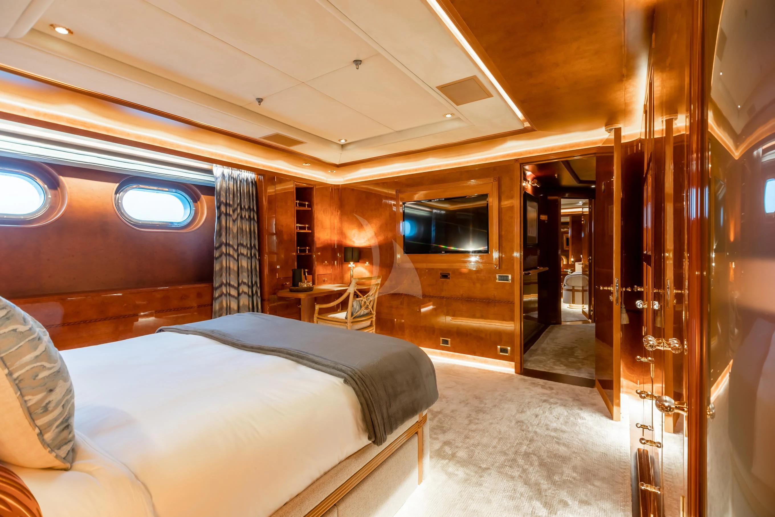 a room with a bed and a television aboard AQUA MARE Yacht for Sale