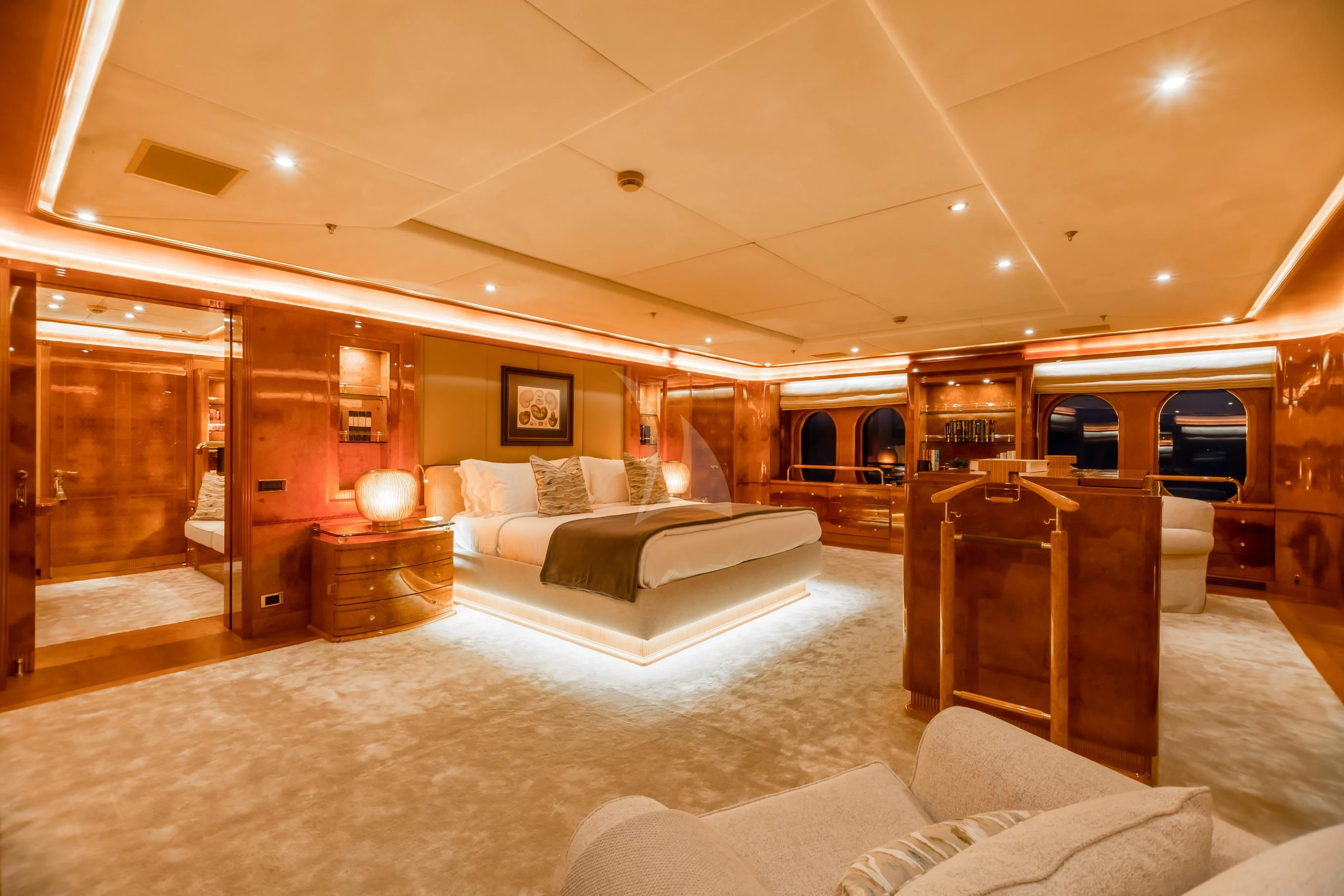 a large living room with a large bed and a couch aboard AQUA MARE Yacht for Sale
