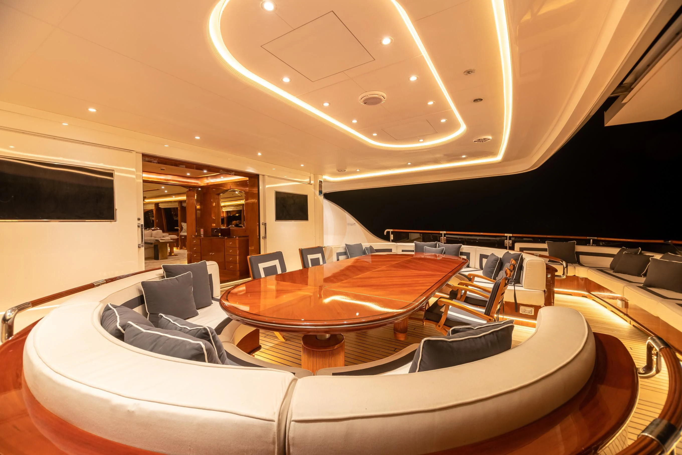 a room with a table and chairs aboard AQUA MARE Yacht for Sale