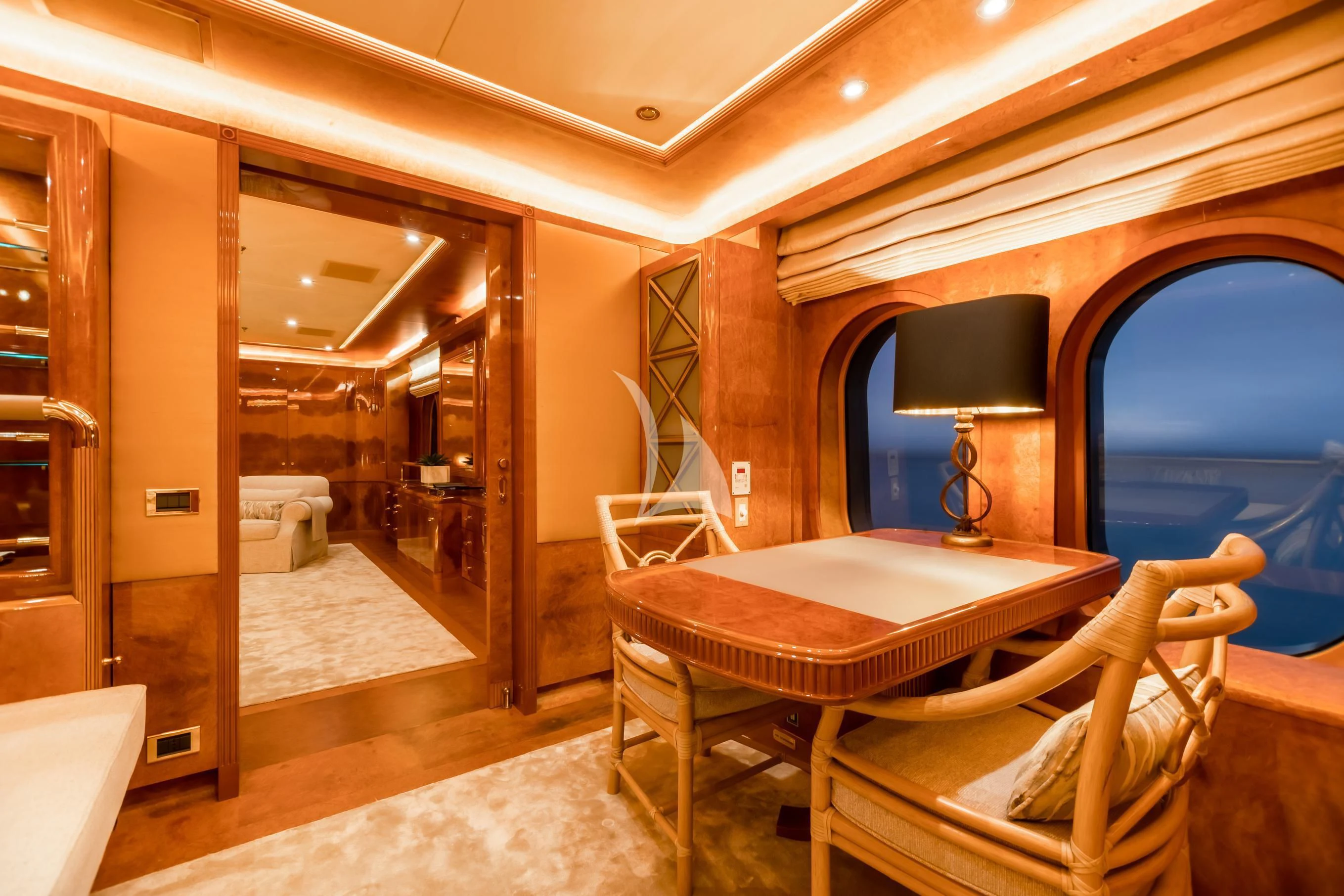 a room with a table and chairs aboard AQUA MARE Yacht for Sale