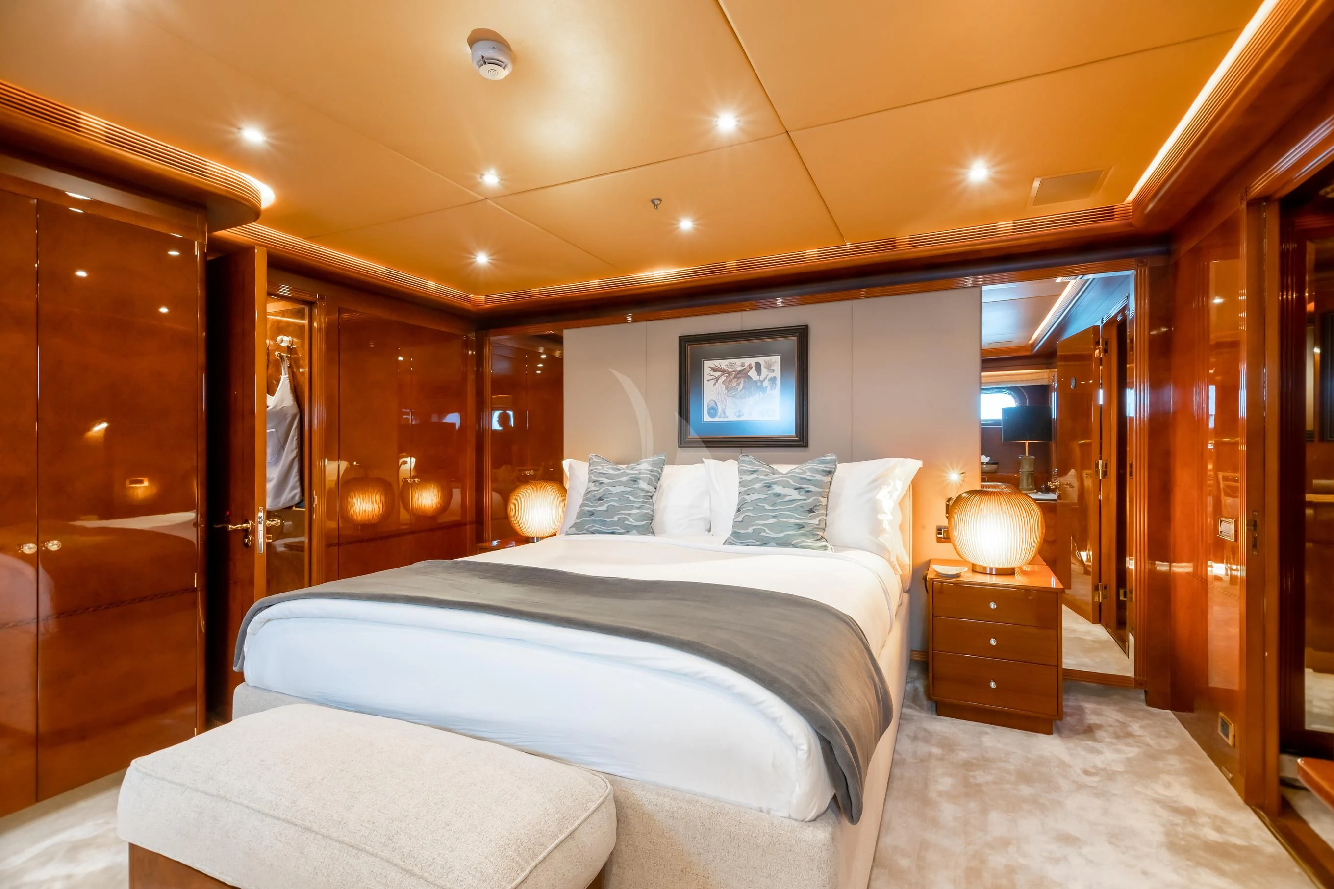 a bedroom with a bed and a mirror aboard AQUA MARE Yacht for Sale