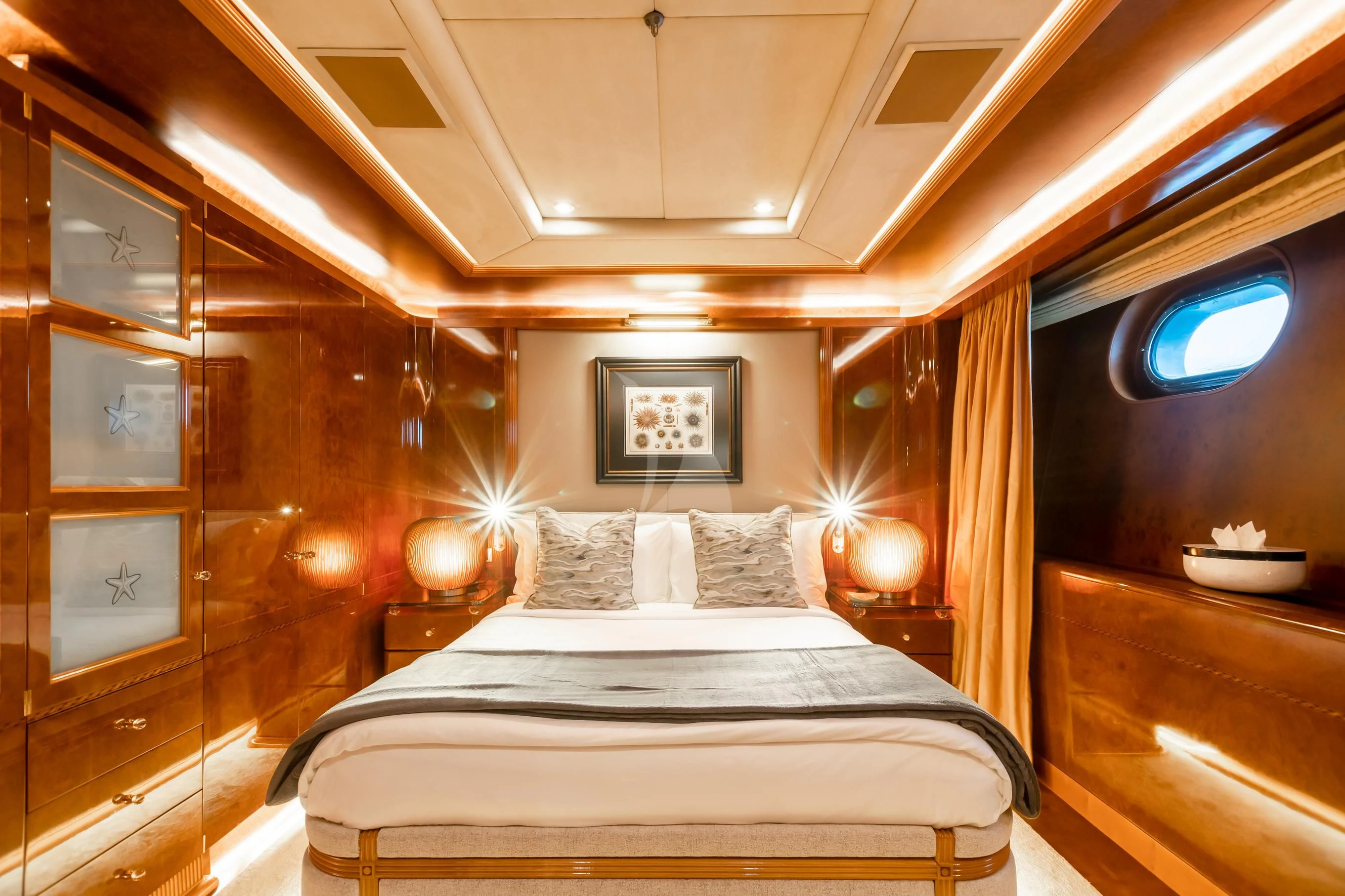 a room with a bed and a mirror aboard AQUA MARE Yacht for Sale
