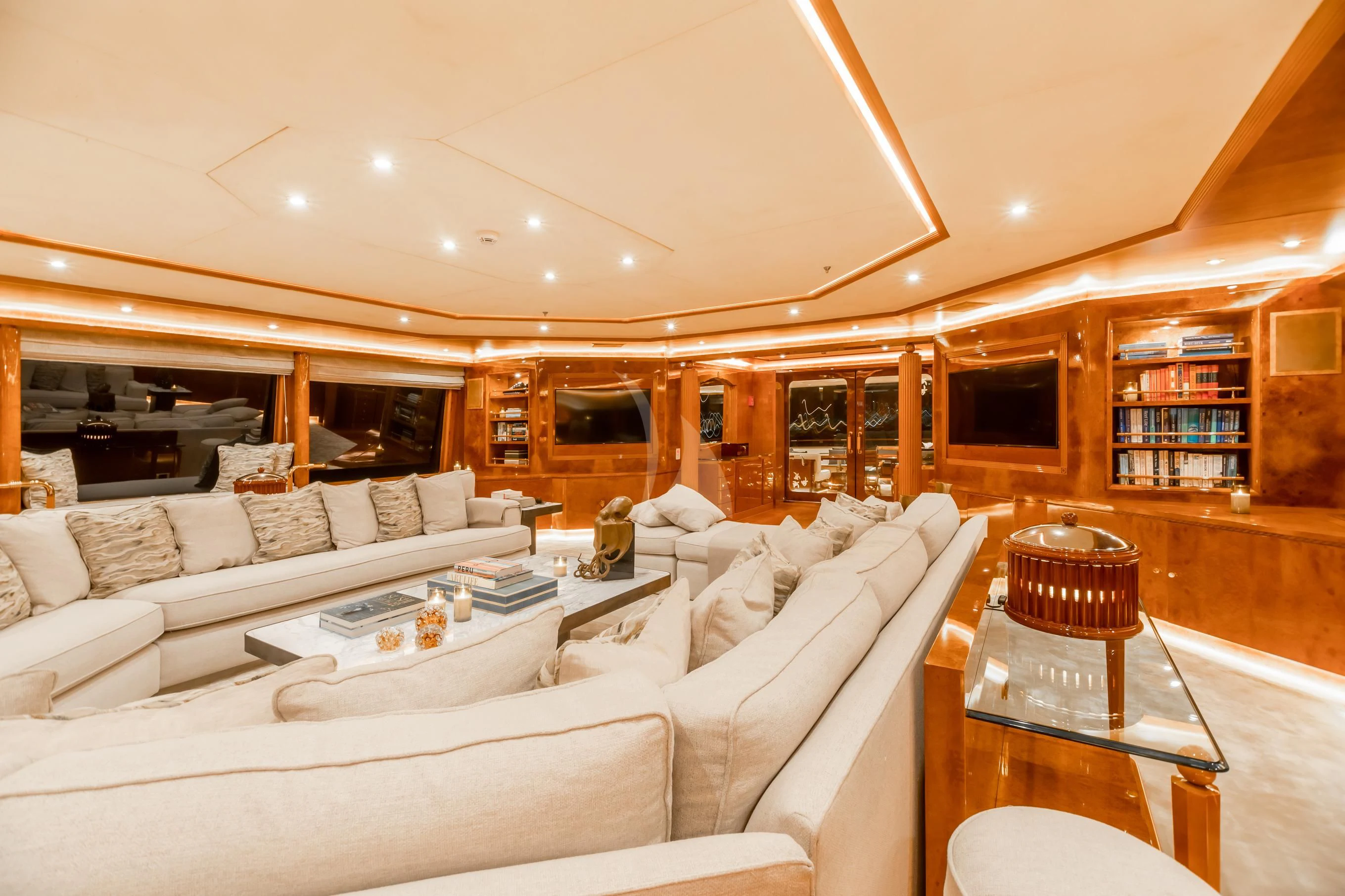 a living room with a white couch and a coffee table aboard AQUA MARE Yacht for Sale