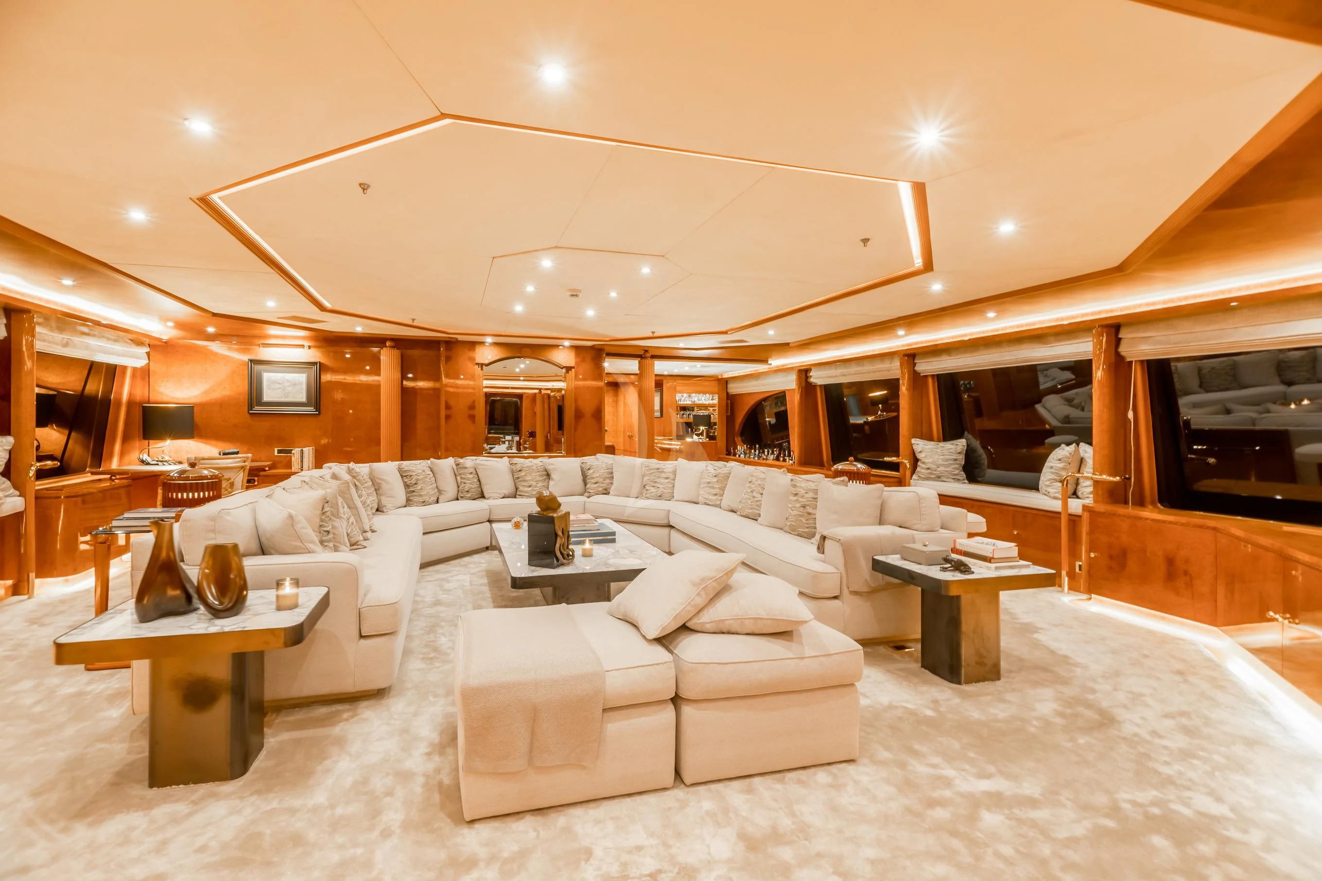 a living room with a large white couch and a table aboard AQUA MARE Yacht for Sale