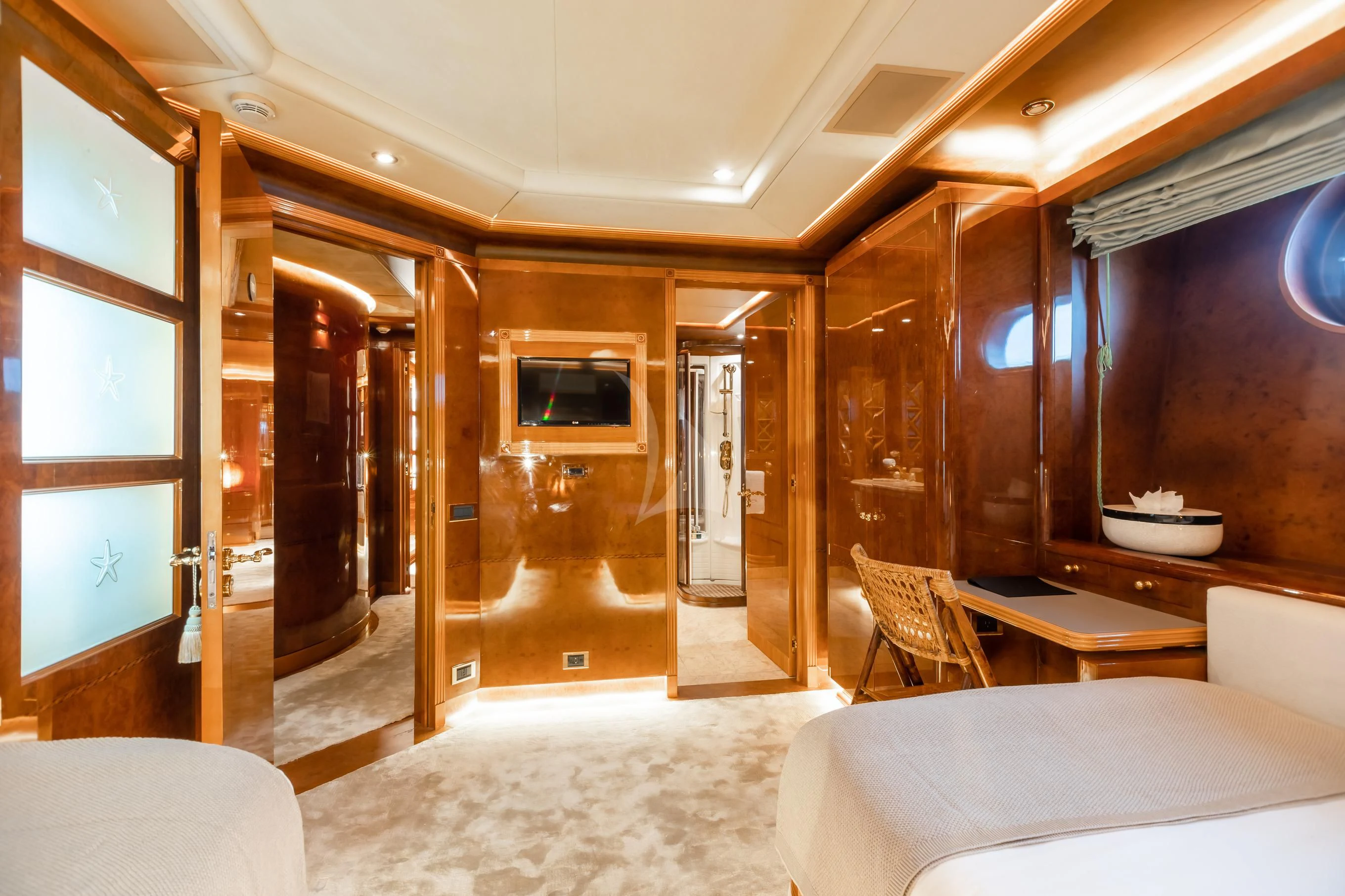 a room with a bed and a tv on the wall aboard AQUA MARE Yacht for Sale