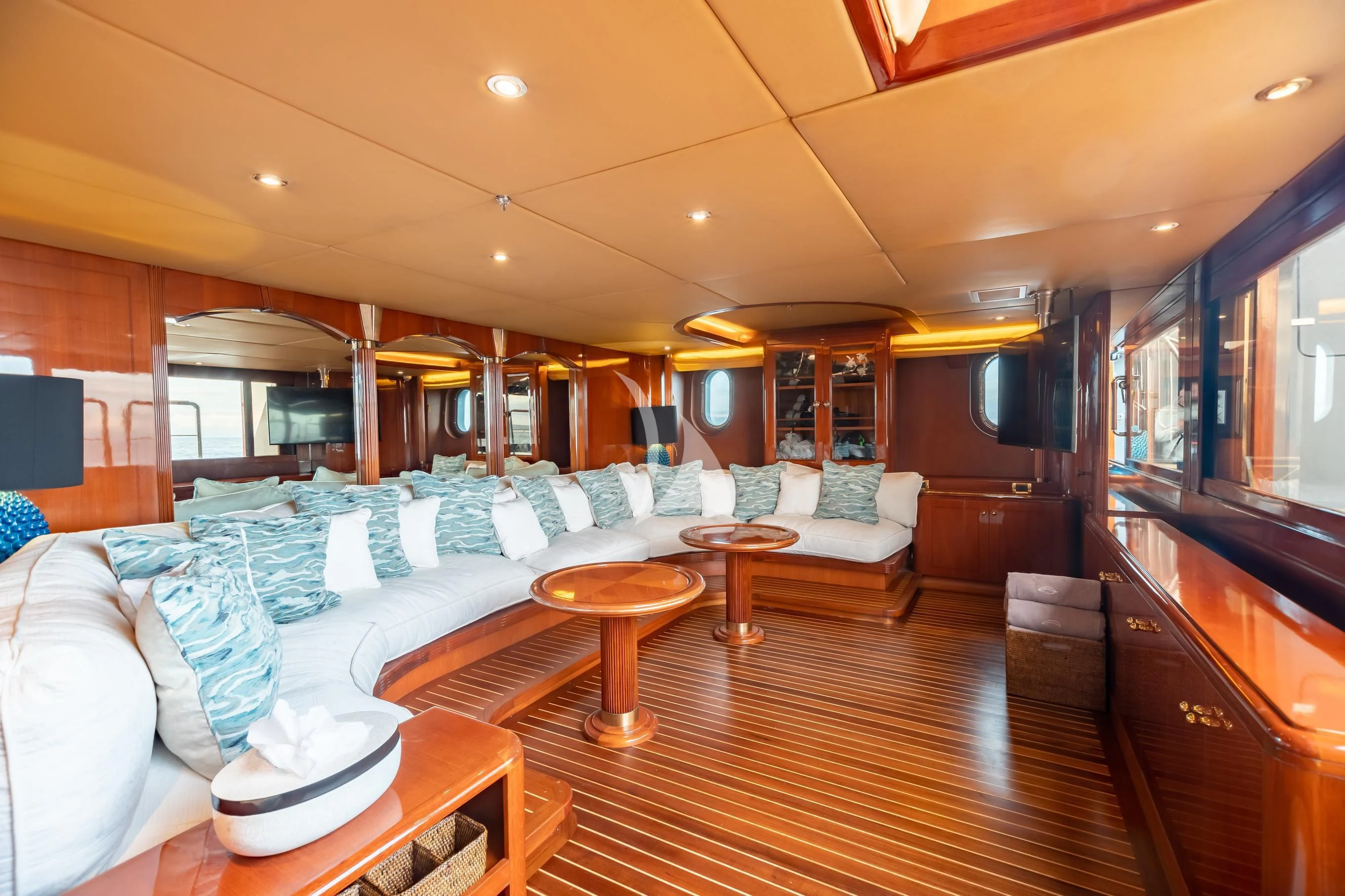 a living room with a wood floor aboard AQUA MARE Yacht for Sale