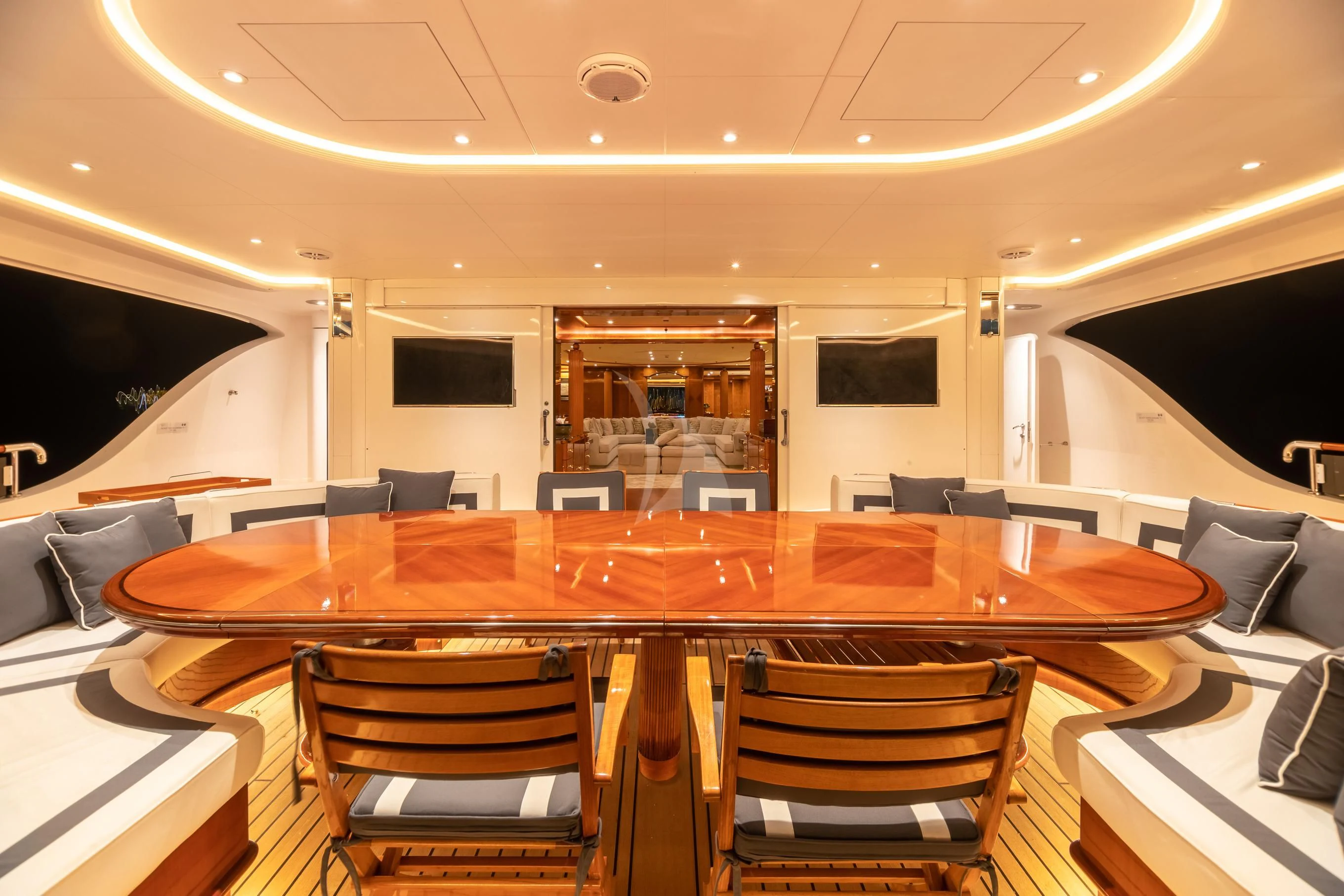 a room with a table and chairs aboard AQUA MARE Yacht for Sale